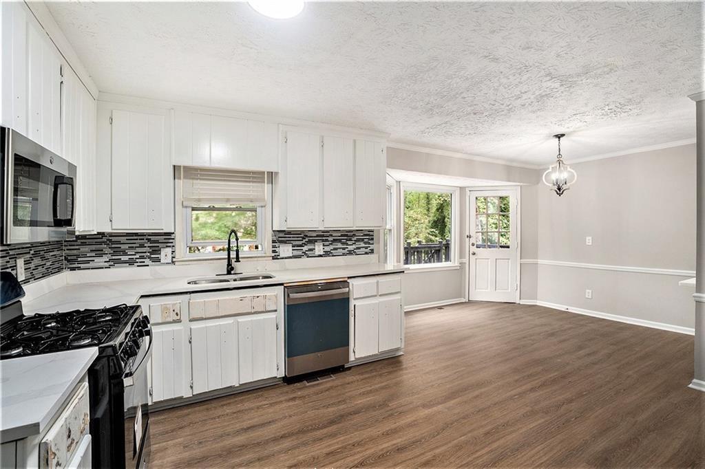 This beautiful 4-bedroom, 3-bathroom home sits on a spacious corner lot in the desirable East Cobb area. The open-concept living space flows seamlessly into a modern kitchen with granite countertops and stainless steel appliances. The master suite boasts a walk-in closet and a luxurious en-suite with dual vanities and a separate tub. Enjoy the private backyard with a deck, perfect for outdoor gatherings. Located near top-rated schools, shopping, and dining, this home offers comfort and convenience. Schedule your tour today!