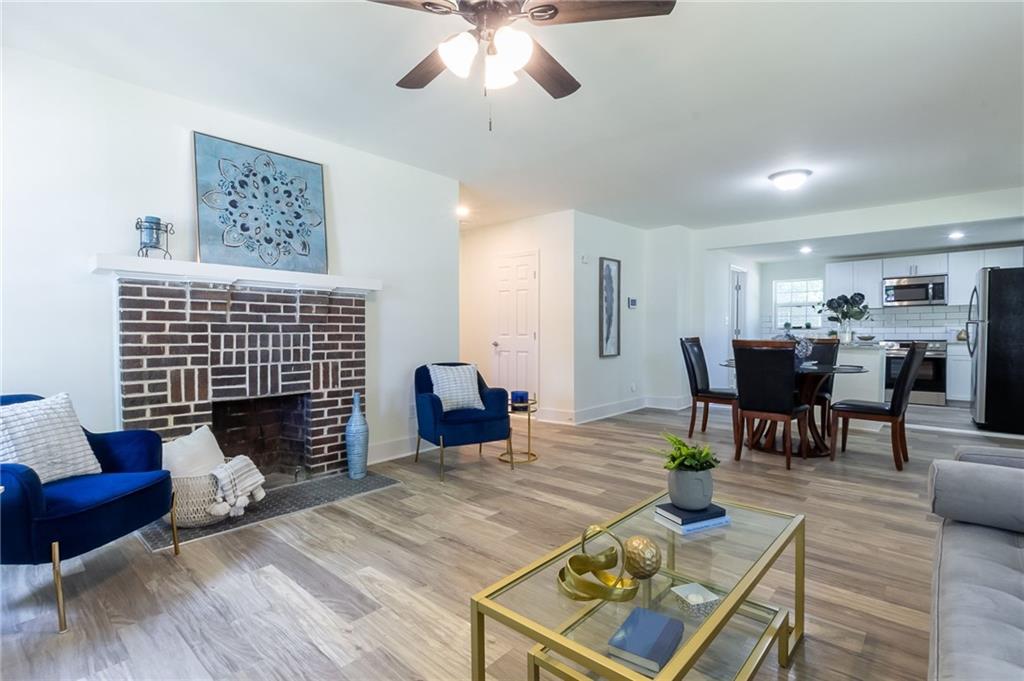 The seller is extremely motivated—bring your offers! This fully renovated bungalow in East Point’s sought-after Center Park neighborhood is a rare find, offering high-end updates, historic charm, and a prime location just minutes from Downtown and the airport. Renovated down to the studs with full permits, no detail was overlooked—from the new systems to the designer finishes. Step inside to an open-concept main level that’s flooded with natural light and anchored by a warm fireplace. The chef’s kitchen features a quartz-topped island, stainless steel appliances, and abundant cabinetry—perfect for everyday living or entertaining. The spacious primary suite offers a walk-in closet and upscale ensuite bath, while a second bedroom upstairs is ideal for guests or a home office. Just off the kitchen, you’ll find a full-size laundry room for added convenience. The finished basement adds valuable living space with an additional bedroom, bonus room, and extra storage—ideal for a second living area, gym, or studio. This home also recently generated $1,950/month in rental income, making it an attractive option for both homeowners and savvy investors alike. And for buyers looking to put their own stamp on the home, the seller is offering a $5,000 credit at closing to be used toward interior paint or any cosmetic modifications of your choosing. Located just blocks from Downtown East Point, parks, the MARTA rail station, and Resurgence Hall K–8 Charter School, this home combines style, substance, and location in one incredible package.