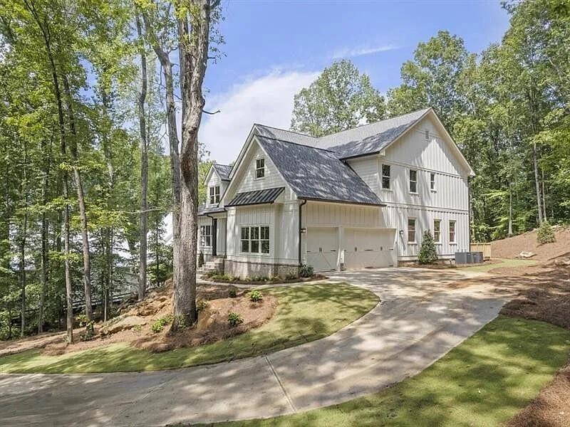 TO BE BUILT – Silver Oaks Luxury Estate with Pool & Spa on 1.87 Acres
Brought to you by Larkin Design and Build, one of North Atlanta’s most highly regarded builders, the Silver Oaks plan is a 3,836 sq ft two-story residence designed with both elegance and function in mind. Photos shown are of the same plan previously built by the builder, exemplifying the artistry and refined finishes expected in this estate. Built on a slab with optional daylight basement, this home also includes a private main-level walk-out pool and spa.
The exterior balances modern farmhouse character with timeless architectural details, leading into a dramatic two-story family room filled with natural light from expansive windows overlooking the pool. The open plan connects the family room, dining area, and chef’s kitchen, where a large center island, custom cabinetry, premium appliances, and a walk-in pantry create both beauty and practicality.
The main-level owner’s suite serves as a luxurious retreat with spa-style bath featuring dual vanities, a soaking tub, oversized walk-in shower, and a custom closet. A secondary bedroom or executive office with full bath access is also located on the main floor. Upstairs, three additional bedrooms and two baths are complemented by a spacious media room and an open gallery overlooking the family room below—perfect for gathering and entertaining.
Outdoor living takes center stage with a covered patio, fireplace, and summer kitchen that flow directly to the pool and spa, offering a seamless indoor-outdoor lifestyle.
As with every Larkin Design and Build project, buyers may tailor finishes through the design team or adapt the plan to their vision.
This estate sits on a 1.87-acre lot only minutes from Downtown Woodstock, Downtown Crabapple/Milton, Alpharetta, Avalon, and Historic Roswell. Everyday conveniences abound with Hickory Flat Village nearby, while golf enthusiasts will appreciate proximity to White Columns Golf & Country Club and Atlanta National Golf Club. Outdoor adventures await at Lake Allatoona and nearby trails, and families enjoy access to top-rated Cherokee County schools, with commuter routes to GA-400 and I-575 close at hand.
Completion is estimated within 8–12 months. An adjacent 1.87-acre lot is also available, offering the flexibility of building either the Ranch plan or Silver Oaks, both designed with distinction by Larkin Design and Build.