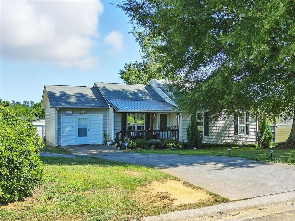 Get a 1/0 lender paid buy down for the first year using our preferred lender! Finally—yard space, a workshop, and a move-in ready ranch that won’t break the budget. This one checks the boxes with a fenced half-acre lot, practical updates, and plenty of flexibility inside and out.
Step inside to easy-care tile and plank flooring, a light-filled living area, and a kitchen with refreshed painted cabinets, stone-look countertops, and stainless steel appliances. The layout keeps things practical with everything on one level—including three full bedrooms and two full bathrooms.
The primary suite offers privacy on one end of the home, complete with updated flooring and soft natural light. Two additional bedrooms sit on the other side of the hall, with a shared hall bath just steps away.
Out back, the fully fenced yard opens up wide and level—ready for dogs, gardening, backyard games, or just a quiet evening by the firepit. The separate workshop offers room for storage, hobbies, or weekend projects. There's even space to add more.
A low-maintenance exterior allows you get more time enjoying the space and less time taking care of it.