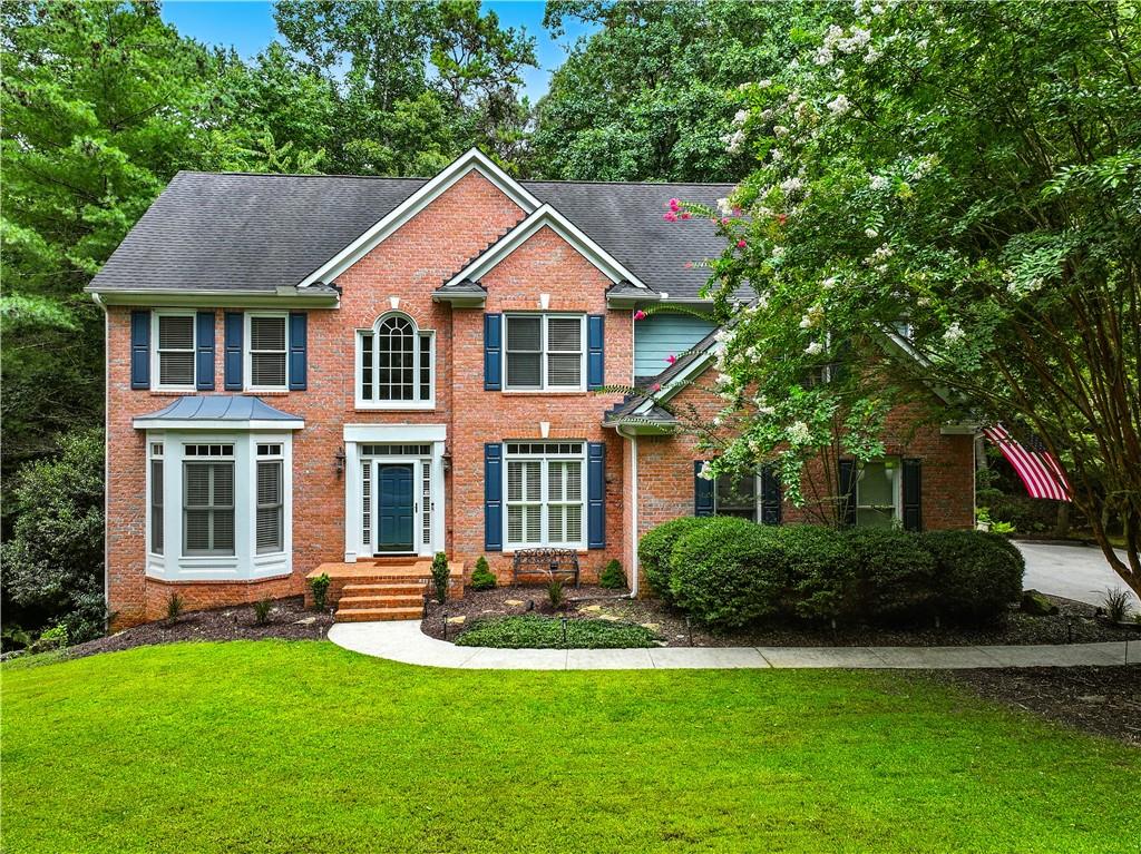 Beautiful 3-Sided Brick Home located in the highly sought-after Grand Cascades neighborhood-one of Suwanee's premier communities-enjoy resort-style amenities including two pools (zero-entry and Jr. Olympic), a beautiful clubhouse, fitness center, six lighted tennis courts, pickleball, a playground, a basketball court, outdoor sand volleyball court, and two fish stocked lakes. Play baseball and soccer on the sport fields or fly a kite on a breezy afternoon all while hearing the wonderful sounds of nature throughout the neighborhood. A favorite family pastime is meandering along side the Chattahoochee River on miles of shaded walking trails!!! A little slice of Heaven while still being close to Northside Hospital and upscale shopping. This stunning 4-bedroom, 3.5-bath home is in walking distance to the amenities and features three finished levels, all nestled on an oversized lot in a park like setting. Step inside to an inviting two-story foyer which leads to the kitchen and opens to a Two-story family room featuring a brick fireplace with built-in shelves-perfect for cozy evenings or entertaining. Enjoy cool fall days on the screened porch overlooking a huge, private backyard. The deck also includes an outdoor grilling area that wraps around to the driveway for easy access. The finished daylight basement includes walk-out access to the backyard, a fire pit area for even more room to relax or entertain. Seller is offering an allowance for fresh paint, flooring and updated kitchen appliances depending on the offer price. All of this, in the top-rated Lambert High School district.