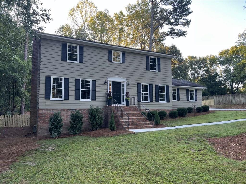 Welcome home to this beautifully renovated two story featuring four spacious bedrooms, fully remodeled bathrooms, custom kitchen with marble countertops and large peninsula, two living spaces, and beautiful screened porch overlooking the large, fully fenced backyard. The main level showcases two living spaces, dining room, kitchen, half bath with custom cabinetry, and laundry room with folding surface and basket storage. All four spacious bedrooms are located on the second level including a pristine hall bath with large vanity and large hall/linen closet. The primary bedroom has a spacious bath with separate vanities, water closet, and large shower with two shower heads and corner bench. Additional features include oak hardwoods throughout, brand new driveway, sprawling flat backyard, attached 2 Car garage, and R-30 Blown-In insulation in the attic. Conveniently located in East Cobb with easy access to I-75 and The Battery Atlanta. No HOA but Pool memberships are available for purchase from Gant Quarters/Mill Brook Farms which is connected to this home's neighborhood.