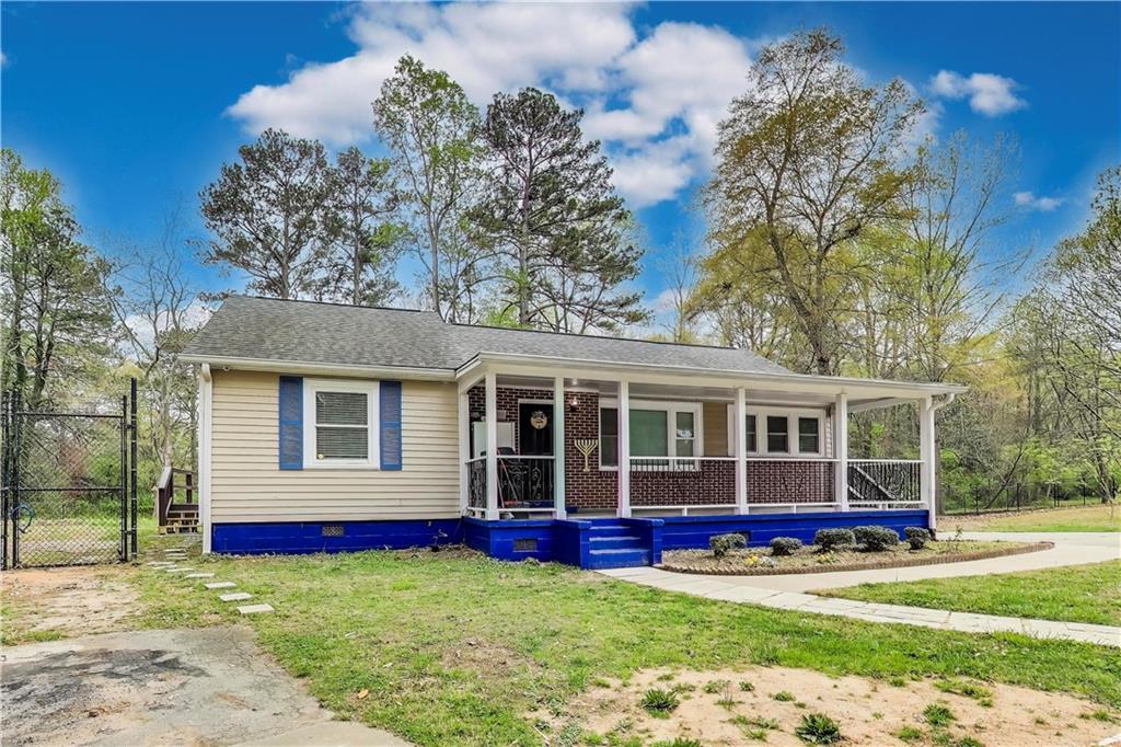 Spacious & Renovated 4 Bedroom Home on .77 Acres in Prime Marietta Location! Welcome to this beautifully renovated home in a prime Marietta location near Smyrna! Sitting on .77 acres, this property offers tons of space both inside and out, making it perfect for families, entertaining, and privacy. As you arrive, you'll love the huge front yard, circular driveway for multiple vehicles, and the big front porch perfect for relaxing. Being the last home on the street, you'll enjoy peace and privacy. The fenced backyard has two storage sheds and has been mostly cleared, offering endless possibilities for outdoor fun. Plus, two porches on each side of the home provide great spots for summer barbecues! Step inside to find a completely renovated interior with recessed lighting throughout, hardwood floors, and updated fixtures. The stunning kitchen features quartz countertops, a stylish backsplash, stainless steel appliances, and beautiful cabinetry. The bathrooms have been fully updated, with luxury vinyl flooring, a new vanity, and a ceramic tile stand up shower. The home offers 4 spacious bedrooms and 2 baths, with the master conveniently located on the main level. There are also two living rooms, one of which could easily be converted into another bedroom. Other key features include: 8 year old roof in great condition, Up to date A/C maintenance, 2 year old water heater, Cement siding in excellent shape & Crown molding & fresh paint throughout. Located just 3 minutes from all your favorite restaurants and stores, this extremely well maintained home offers the perfect mix of space, privacy, and convenience. Don't miss out! Schedule your showing today!