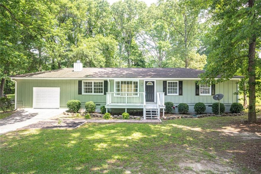 Charming 3-Bedroom Home Near Downtown Lawrenceville!

Welcome to this beautifully updated 3-bedroom, 2-bath home situated on a quiet street just minutes from downtown Lawrenceville and the Gwinnett County Fairgrounds. With 1,248 square feet of living space and sitting on almost half an acre, this property offers the perfect blend of comfort, convenience, and room to grow.

Step inside to find fresh paint throughout, brand-new carpet, and hardwood floors that add warmth and character. The spacious layout is perfect for both everyday living and entertaining.

Enjoy the freedom of no HOA and take advantage of the home's unbeatable location—close to shopping, dining, parks, and major highways including GA-316. Whether you're commuting, exploring the vibrant local area, or simply relaxing at home, this property is a must-see!

Don’t miss your chance to own a move-in ready home in a prime location!