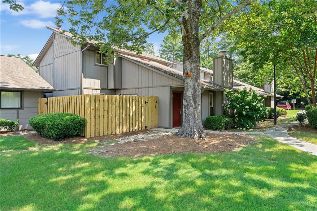 Fully Renovated 3-Bed Condo with Dual Patios, Oversized Garage & Designer Finishes! Modern updates include all-new cabinets, vanities, lighting, LVP/tile/carpet flooring, quartz & granite countertops, and an exotic zebra wood kitchen feature. New appliances (gas range w/vent hood, built-in microwave, and dishwasher), A/C (interior unit), water heater, and re-routed HVAC ducting for ideal airflow. Open layout connects living space to patios with sliding glass and French doors-creating a perfect flow for entertaining! Both patios have been refreshed with new fencing and artificial turf for easy pet cleanup and low-maintenance outdoor living.