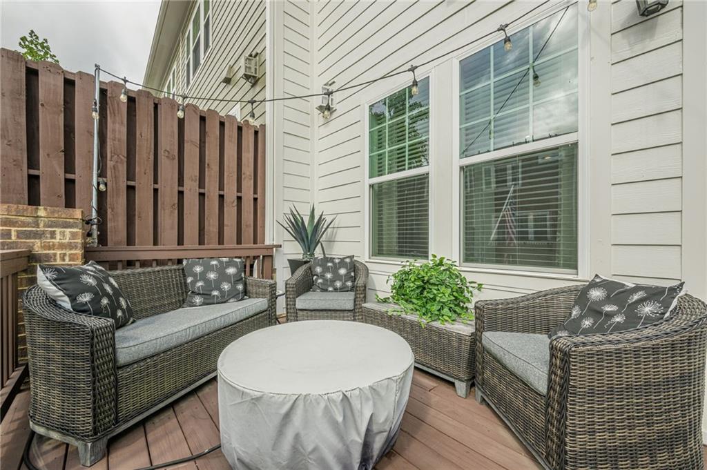 MUST SEE This immaculate, Move-in-Ready Townhome Conveniently located in the Heart of Alpharetta with easy access to Northpoint Mall, Avalon, Marriott, and all the best shopping, restaurants & schools nearby. You’re going to love the elegant & inviting modern design. Step into the stylish layout of the bright & airy MAIN LEVEL with its soaring ceilings but stay cozy with the gas-started fireplace in main living area - Step out onto the balcony for even more entertaining potential. The gourmet eat-in, open-concept, chef’s inspired kitchen features gorgeous, oversized island & breakfast bar, sleek, stainless-steel appliances, a fridge that stays, plenty of white cabinets & ample granite counter workspace, dual ovens, and butler’s pantry. UPSTAIRS you have the primary ensuite featuring dual vanities, classy custom shower with glass doors, a bench seat, walk-in-closet & private toilet. There is also a spacious secondary bedroom with full hall bath, a laundry room, and attic access for more storage space with disappearing stairs. Plus, a sizable loft which could easily be converted into another bedroom if desired. Downstairs you have a media bonus room or even potential future bedroom with a half bath, coat closet, 2 car garage & 2 car driveway for extra guest parking. The local Community Offers a Pool, Excellent top-rated schools, plus Alpharetta’s thriving amenities & active lifestyles like — dynamic shopping, fine dining, parks, and convenient access to major tech companies, all nearby. Ask about buyer’s incentives and TOUR TODAY Before it Gets Away!