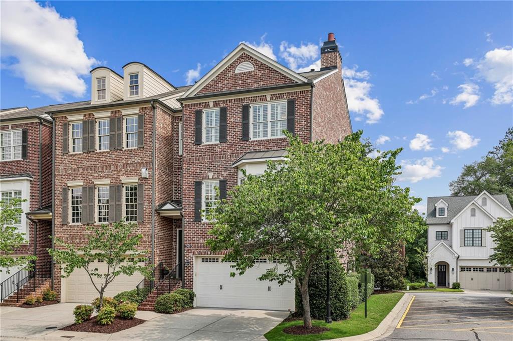 Nestled in the heart of Alpharetta's vibrant downtown Garden District, this bright and airy brick end-unit townhome offers unbeatable access to the city's top amenities. Just a short stroll away, you'll find an array of local restaurants, charming shops, outdoor concerts, and the Farmer's Market everything you need right at your doorstep. This beautifully appointed townhouse offers privacy, space, and convenience in equal measure. Featuring four generously sized bedrooms and three-and-a-half bathrooms, this home delivers comfortable living in a vibrant community setting.
Step inside to discover a flexible layout with bright, open concept living areas ideally suited for both relaxed evenings at home and weekend entertainment. The bright white custom kitchen features stainless steel appliances, under cabinet lighting, marble countertops, backsplash and a spacious island which flows seamlessly into a warm and inviting living area, highlighted by a cozy fireplace and dry bar, ideal for entertaining or relaxing. The upgraded light wood flooring throughout the home just oozes that modern luxury feel. The 10-foot ceilings don’t disappoint even the most discerning buyer. The adjacent dining and living areas flow seamlessly, enhanced by natural light that streams in from multiple exposures.
At the top of the home, you’ll find a spacious primary bedroom suite—a calm and quiet space complete with a walk-in closet and a spa-like en-suite bathroom. The additional bedrooms accommodate guests or the perfect work-from-home setup, and a conveniently located laundry area adds ease to everyday living. You can also worry less knowing your HVAC units are new. The versatile terrace level features a full bath and a flexible space perfect for an office, extra bedroom, or home gym, along with two storage closets.
Being an end unit has its perks—more windows, more light, and just a little quieter from the world outside. Plus, a private covered patio offers a peaceful outdoor spot for your morning read or evening refreshment or the upstairs deck off the main level for al-fresco dining. This is one of the few townhouses with an actual fenced backyard which comes with maintenance free turf.
Parking is a breeze with a two-car garage and an accommodating driveway for two more vehicles, and beautifully finished with an epoxy floor coat. Additional highlights include newly painted, plantation shutters, upgraded floors throughout, new HVAC systems, smart Wi-Fi Thermostats, garage storage, custom closet systems.
This townhouse checks all the right boxes for buyers seeking space, privacy, and a prime Alpharetta location. Whether you're upsizing, downsizing, or rightsizing, this home offers an exceptional blend of lifestyle and livability.