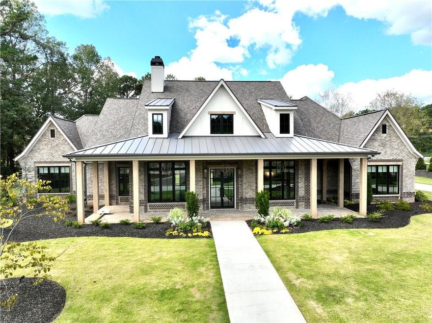 Use 250 Old Jones Rd. Alpharetta, Ga. 30004 for GPS. This stunning Craftsman-style home offers luxury living in Alpharetta's sought-after Cherokee County. Boasting exquisite brick construction on four sides, this home exudes elegance and charm. Nestled in Alpharetta, Georgia, this property offers the perfect blend of suburban tranquility and urban convenience. Enjoy easy access to top-rated schools, parks, shopping centers, and dining options. Experience culinary excellence with top-of-the-line appliances. Elevate your living space with locally crafted custom cabinets. Enjoy the timeless beauty and durability of stain in place hardwood flooring throughout the home. Featuring exquisite concrete countertops with built-in sinks. Entertain in style with a fully equipped outdoor kitchen featuring Wolf and Sub Zero appliances. Relax in the shade of the covered patio, adorned with elegant herringbone brick detailing. Prepare to be amazed by the meticulously designed master closet, perfect for the discerning client. From intricate trim work to designer fixtures, this home is filled with upscale details that set it apart from the rest. Prewired EV garage outlet. Our roofing materials are made with F Wave premium synthetic roof shingles and offer a lifetime warranty. They are made to with withstand 130 mph winds, Class 4 Hail, and Class A fire protection. Our Casement windows offer you a 10 year warranty (20 year glass warranty). Seamlessly control you lighting, climate control, surround sound, and Lutron window shades with a simple touch on your phone. In addition to the main living and bonus square footage, this home includes an additional 2411 square feet (front and rear porch plus garage) for a total of 6434 square feet (under roof and all other areas). Showings scheduled upon receipt of Proof of Funds (POF) or PreQual Letter. Listing agent will be present for all showings. Floor plan shown has been altered to add more square footage. Security Camera’s in Use.