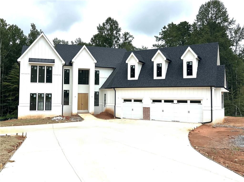 Welcome to timeless design and uncompromising craftsmanship in The Manors, a gated community of custom homes within the coveted Jefferson City School District. This bespoke NEW CONSTRUCTION home sits on a 2.86-acre homesite and offers a seamless blend of elevated style, functionality, and privacy. A striking two-story foyer sets the tone upon entry, opening to a thoughtfully designed main level with purposeful living and entertaining spaces—including a formal dining area, private study/flex room, and an expansive fireside living room with views of the covered back deck and tree-lined backyard. The CHEF’S KITCHEN impresses with CUSTOM cabinetry, an oversized island, walk-in pantry, and direct connection to both indoor and outdoor entertaining areas. The main-level primary suite is tucked away for privacy and features a serene SPA BATH with a freestanding tub, curated designer tile selections, and an oversized walk-in closet with custom built-ins. Upstairs offers three additional bedrooms, EACH with private en-suite baths, plus a media room/loft area ideal for study, gaming, or additional lounge space. A HUGE unfinished basement offers long-term flexibility and room to grow. Walk out from basement into expansive, PRIVATE backyard with plenty of room for a future pool. The 3-car garage has unfinished storage space above it for even more possibilities. The outdoor space offers privacy and tranquility with plenty of room for a future pool. Wait until you see this homesite! WOW. Designer touches throughout set this home apart from standard new construction. Completion is expected October/November 2025. Photos show construction in progress. A rare opportunity to own in one of Jefferson’s most prestigious communities. Schedule your private tour!