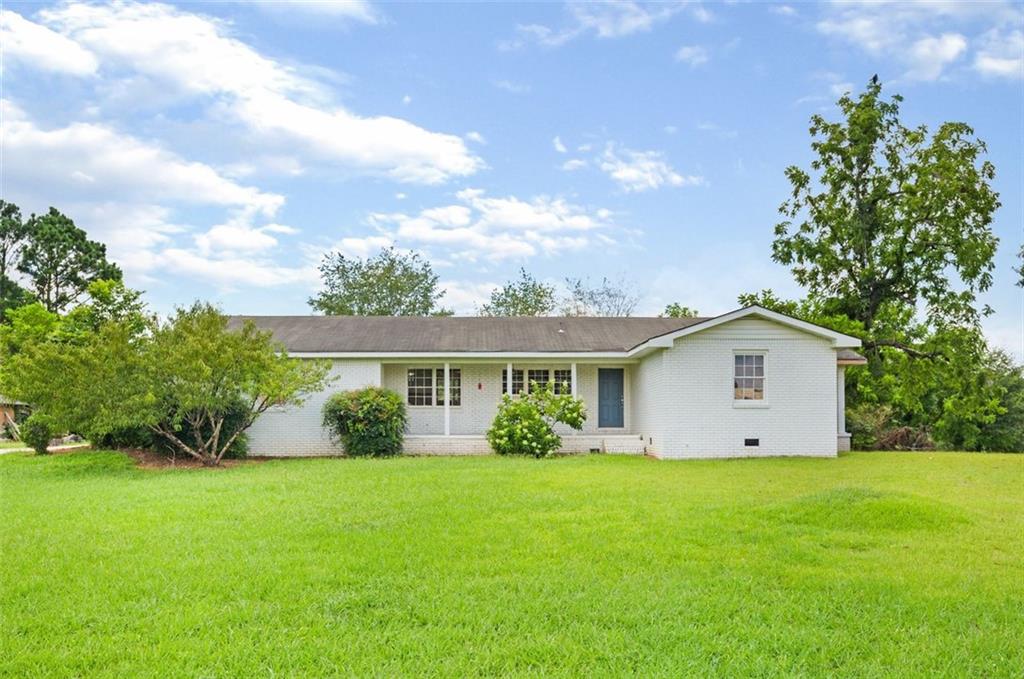 Nestled on 2.24 acres of lush, flat, and private land in the heart of fast-growing Canton, GA, this charming ranch-style home offers the perfect blend of tranquility, space, and potential. Offering three spacious bedrooms and two full bathrooms, this home features a thoughtful, functional layout with great flow throughout. With solid construction and timeless charm, it presents a wonderful opportunity for cosmetic enhancements — ideal for buyers looking to personalize and add value over time.
A long driveway leads you in, offering ample parking, a covered carport with storage, and a convenient side entry. The front of the home features a welcoming porch overlooking a spacious, grassy front yard.
Inside, you're welcomed by a cozy living room with a fireplace, ideal for comfortable everyday living. The separate formal dining room is oversized and perfect for entertaining, while the extra-large kitchen features stainless steel appliances, a gas cooktop, and abundant cabinet and counter space — a wonderful canvas for culinary creativity.
Step outside to the dreamy backyard oasis, featuring a large deck with built-in bench seating, surrounded by mature trees and serene privacy. With flat, usable land, there’s ample space to add a pool, garden, a large guest house and/or outdoor living area.
Whether you’re seeking privacy, space, or potential, this home delivers on all fronts. Home is virtually staged.