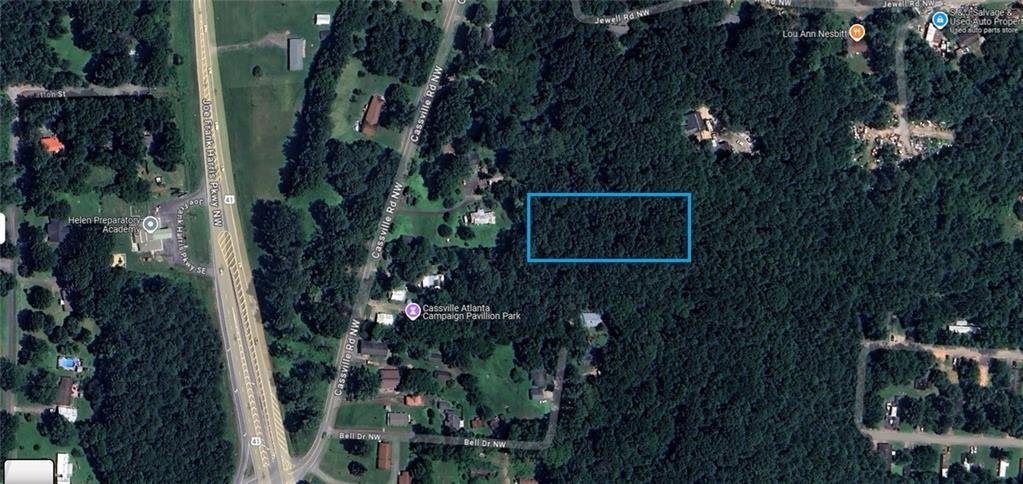Build your dream home on this very rare private 1.5-acre buildable lot. Close to HWY 41, Interstate 75, shopping, restaurants, and wonderful schools! Currently zoned R4, lot does have an easement for entry. If you are looking for a private estate lot over an acre close to everything this maybe the perfect spot! The easement drive will dead-end into your lot. The lot does have an incline to a Plateau at top offering the perfect home site with great views and privacy. The lot offers mostly great hardwoods as pictured. Please call for a tour or more information. Builders and private parties are welcome to inquire.