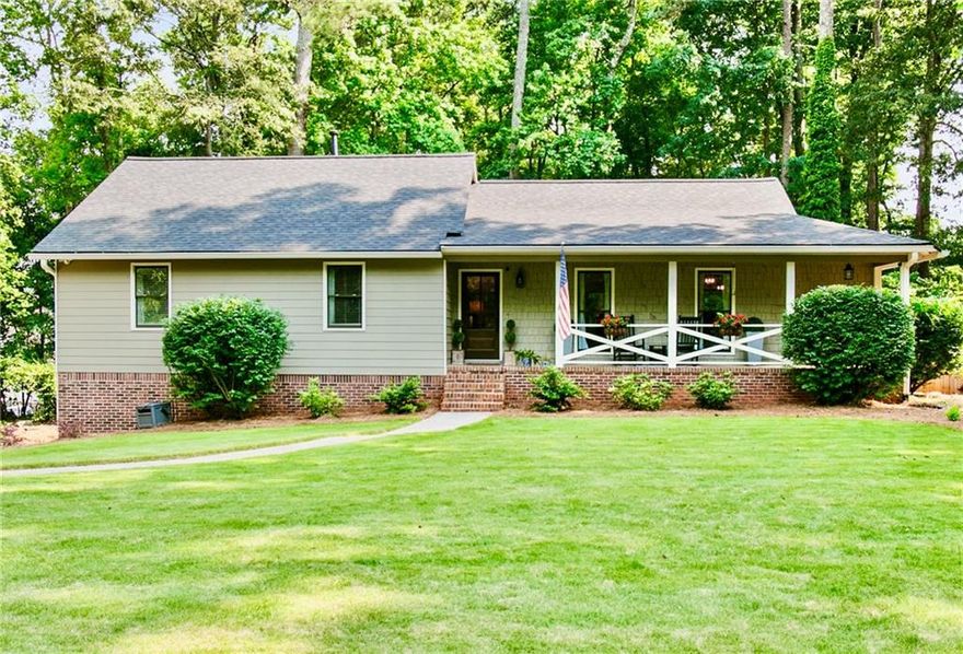 In the Heart of West Cobb, this Ranch on a Basement has all the Updates! Open Concept Floor Plan with 4 Bedrooms, 2 Baths & LVP Flooring throughout Main Level. The Covered Rocking Chair Front Porch welcomes you. This Home has had Walls Opened Up, Paneling Removed & Ceilings Smoothed to Created a Vibrant and Modern Living Space. The Completely Remodeled Kitchen features Wellborn Cabinets with Spice/Utensil Drawers, Level 6 Quartz Counters and an Upgraded Picket Backsplash. New LG Stainless Appliances, Under Cabinet Lighting and an Oversized Center Island with Hidden Outlets complete this Perfect Entertaining Space. Walk-in Butler's Pantry designed by Artisan Closets with Cabinets & Dedicated Line for Appliances. Spacious Family Room with Vaulted Ceiling and Fireplace. Primary Suite has an Expanded Closet with Customized Shelving from Artisan Custom Closets. Master Bath boasts Several Upgrades including Wellborn Cabinets with Hidden Electrical Outlets, Double Vanity with Level 6 Quartz Counters and a Tile to Ceiling Shower with Two Large Niches and a Foot Niche. All Secondary Bedrooms have Walk-in Closets. Finished Basement has a 4th Bedroom and a Generous Closet. This Extended Room could also be another Family Room, Office or Fitness Area. Redesigned Laundry Room with Deep Mud Sink, Cabinets and Hanging Racks. Washer/Dryer Remain. HUGE Fenced Backyard for Kids and Pets. 2023 Landscaping including Zeon Zoysia, Bushes, Bulbs and Grasses. 2024 Beautiful Screen Porch and Large Grilling Deck. 2024 HVAC System. 2020 Roof with 2023 Duct Cleaning. 2022 Improvements include All New Windows, Interior/Exterior Paint & New Exterior Doors. 2024 New Oversized Garage Doors Installed. Lake Somerset is Lovely Community with Swim/Tennis and a Private Lake. Hillgrove High School. Perfect End of the Street Location with Extra Parking. This is TRULY a Must See!