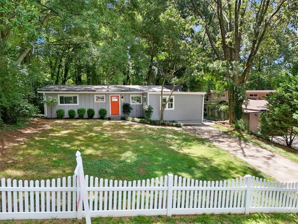 Tucked on a quiet street in Brookhaven’s sought-after Drew Valley neighborhood near Ashford Park Elementary, this fully renovated mid-century gem blends timeless charm with modern comfort, and a lifestyle you’ll love coming home to. Step inside to soaring vaulted ceilings, sparkling hardwood floors (refinished April 2024), and a bright, open living space designed for connection. The completely new kitchen (2023) features shaker cabinets, quartz countertops, and stainless steel appliances, flowing effortlessly into a spacious living area with glass french doors to the private deck - perfect for weekend gatherings, grilling with friends, or simply enjoying the outdoors. The primary suite is a serene retreat with a double vanity, soaking tub, and separate shower, while three additional bedrooms and a stylish full bath are tucked on the other side of the home, offering both privacy and function. Outside, a fully fenced backyard is ideal for pets and play, complete with a white picket fence in front that adds curb appeal and charm. Wave to neighbors walking by or toss a ball in the front yard under the trees; it’s that kind of street. Enjoy peace of mind with a fully encapsulated crawl space (2024), electrical updates (2024), and reinforced decking (2024) already in place. All just minutes from Briarwood Park, Skyland Park, Brookhaven Farmers Market, and the shops and dining along Dresden Drive and Town Brookhaven - with easy access to Buckhead, I-85, and all the perks of intown living. No HOA. This one has the location, the updates, and the feel-good lifestyle to match. Come see it in person and picture your life here.