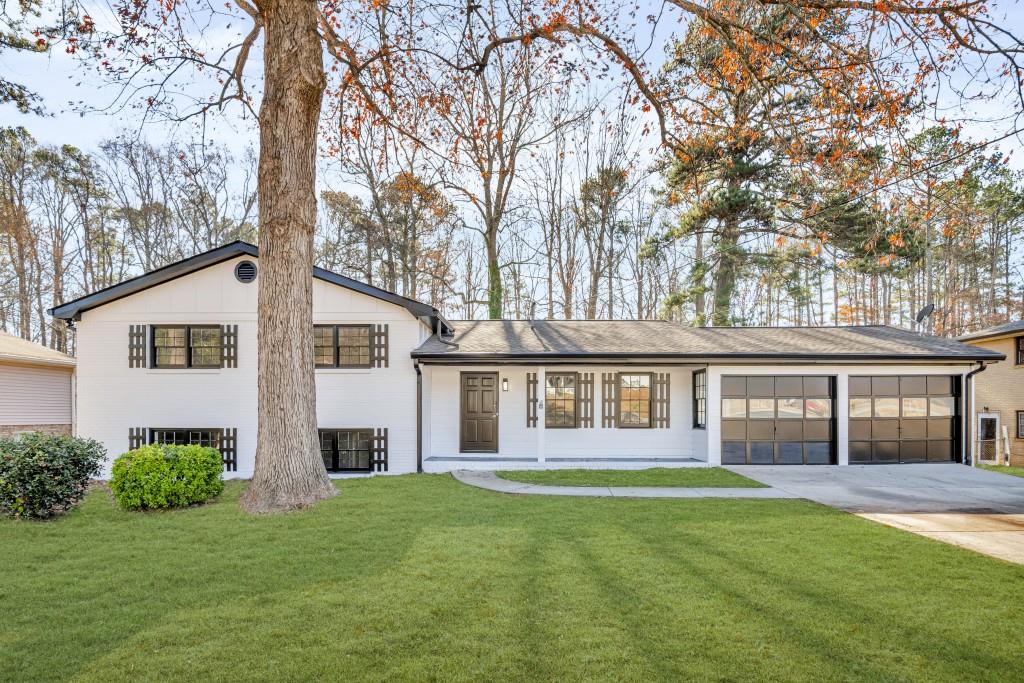 Welcome to This beautifully remodeled split-level home offers the perfect combination of modern updates and timeless appeal. Featuring 4 bedrooms and 2.5 bathrooms, including a fourth bedroom and half-bathroom conveniently located in the basement, this property is thoughtfully designed to meet the needs of today's homeowners. Inside, you'll find a bright and inviting interior with fresh paint and new flooring throughout. The updated kitchen features brand-new countertops and modern appliances, blending style and functionality to create a welcoming space for meal preparation and gatherings. The remodeled bathrooms offer contemporary fixtures and finishes, providing a fresh, updated feel. The versatile split-level layout adds flexibility, combining privacy with open spaces that are perfect for both family living and entertaining. The home's exterior has been freshly painted, enhancing its curb appeal and complementing the spacious yard, which is ideal for outdoor activities, gardening, or simply relaxing. Located, this property offers proximity to Arbor Place Mall for shopping, as well as popular dining options like Gabe's Downtown and Sam & Rosco's Restaurant. Move-in ready and awaiting its new owners, 5893 Tonya Lane is an excellent choice for anyone seeking an updated home in Douglasville. Schedule your visit today!