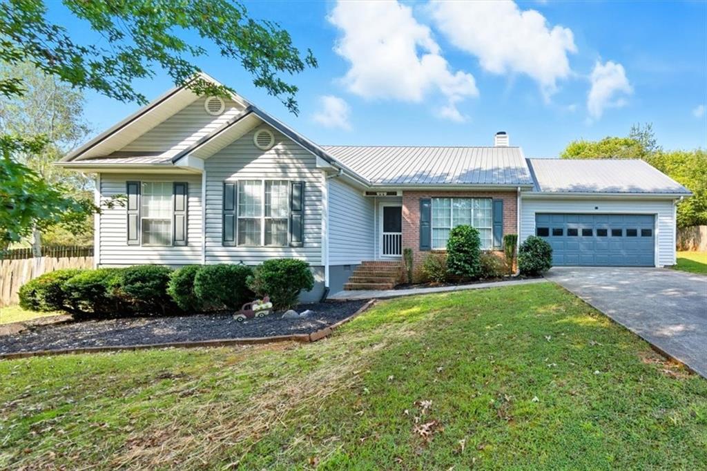 Pristine Ranch home now available in awesome location as minutes to 75, 41 and Buc-ees! You will fall in love when you walk through the door. 3 bed, 2 bath home is just what your buyer is looking for as nestled on this large 0.65, well landscaped lot. Privacy fence is great for privacy, family, and pets! Lovely open floorplan with beautiful, soft decor. Fabulous LVP floors throughout this home for easy cleaning. Pass-thru window from kitchen allows viewing living room and dining room. Fireplace is located in the living room, awesome kitchen includes Refrigerator, stove, dishwasher and vent hood. Lovely cabinets and place for eat-in area. Easy access to 2-car garage on kitchen level. Dining room offers access to covered porch that overlooks this fabulous fenced backyard. The primary bedroom is spacious with walk-in closet and large bath with Separate tub and shower. Both secondary bedrooms are a good size and large closets. The kids will love the playset staying with this home at closing.