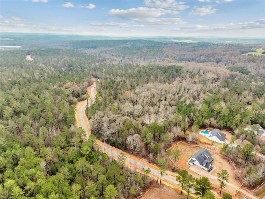 FINAL LOTS AVAILABLE!!! Survey and Soil Test already complete! Welcome to The Gates at Harmony Grove, one of Jackson County's most beautiful estate lot subdivisions. Located just minutes from Jefferson, Commerce, Athens, and Nicholson, this amazing piece of property will be sure to take your breath away. The community features 15 estate sized lots ranging from 8-16+ acres, as well as a private gated entrance, private gravel (soon to be paved) road, streetlights, and underground utilities. This lot is unique and features mature hardwoods, pines, and an abundance of wildlife. Protective covenants and HOA in place to share maintenance of the road, streetlights, and gated entry upkeep. Come build your dream home on the last remaining parcel in The Gates at Harmony Grove. Builder, Kingsworth Construction & Custom Homes. Don't know where to start? We have you covered from beginning to end and will make sure the process is easy and stress free. Don't miss this opportunity to secure your estate homesite in the Jackson County school district!