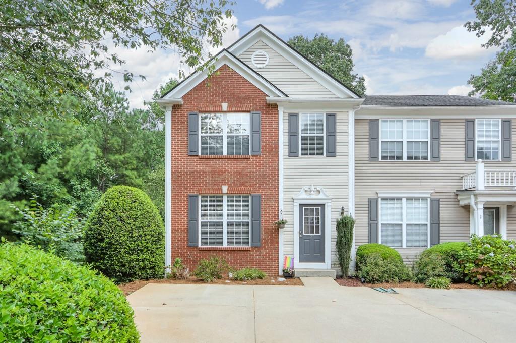 This UPDATED & END unit townhome is in a PRIME, Johns Creek location and offers an OPEN CONCEPT main level living! The entrance foyer leads into your large, gourmet kitchen that's updated with granite counters, tile backsplash, stainless appliances, and has an open view to the FIRESIDE family room. There's plenty of space to entertain or spend time with family on this main level which also features a dining room & a half bath. The master suite is upstairs and features VAULTED ceilings, a WALK-IN closet, and an updated bathroom with double vanities and ceramic tile floors. Two additional bedrooms are upstairs that share a full bathroom. And there's more - a FULL, FINISHED BASEMENT - such a RARE thing to find for townhomes in this area - and it offers a huge media room along with a separate bonus room/possible 4th bedroom! You'll enjoy spring and fall evenings on your NEW DECK which has a beautiful view of the woods. You're in the perfect spot in the community - tucked back at the end of the cul-de-sac with a private back yard. Some additional upgrades and features include a NEW ROOF, NEW HVAC, NEWER CARPET, FRESH INTERIOR PAINT, and beautiful laminate, wide-plank HARDWOODS on the main level. The location can't be beat with close proximity to GA 400, schools, shopping, dining and all that Johns Creek, Roswell & Alpharetta have to offer! This is honestly a rare find!