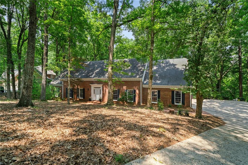 A rare rental opportunity, situated in a cozy cul-de-sac within the highly desirable subdivision of Huntcliff, this home has everything you need! A four sided brick beauty with traditional southern charm and a stunning 5,000 square feet New interior paint throughout, new carpets and new appliances! The foyer opens up to a large formal dining room and a perfect dedicated office space. An oversized master on main overlooking the back deck and featuring a spacious bathroom that includes a soaking tub, separate shower and two individual vanities! You will have plenty of space to entertain between the stunning den and the informal living area that provides an unrestricted view of the kitchen. Upstairs you will find four large bedrooms with two additional bathrooms and a seating area right at the top of the stairs, perfect for a reading nook! Do not forget about the unfinished basement that allows for an extra 2,500 square feet ready for your finishing touches! On a very private lot surrounded by trees and nature, it is truly an oasis! This property is a huge value add and boasts the best parts of the traditional brick house.