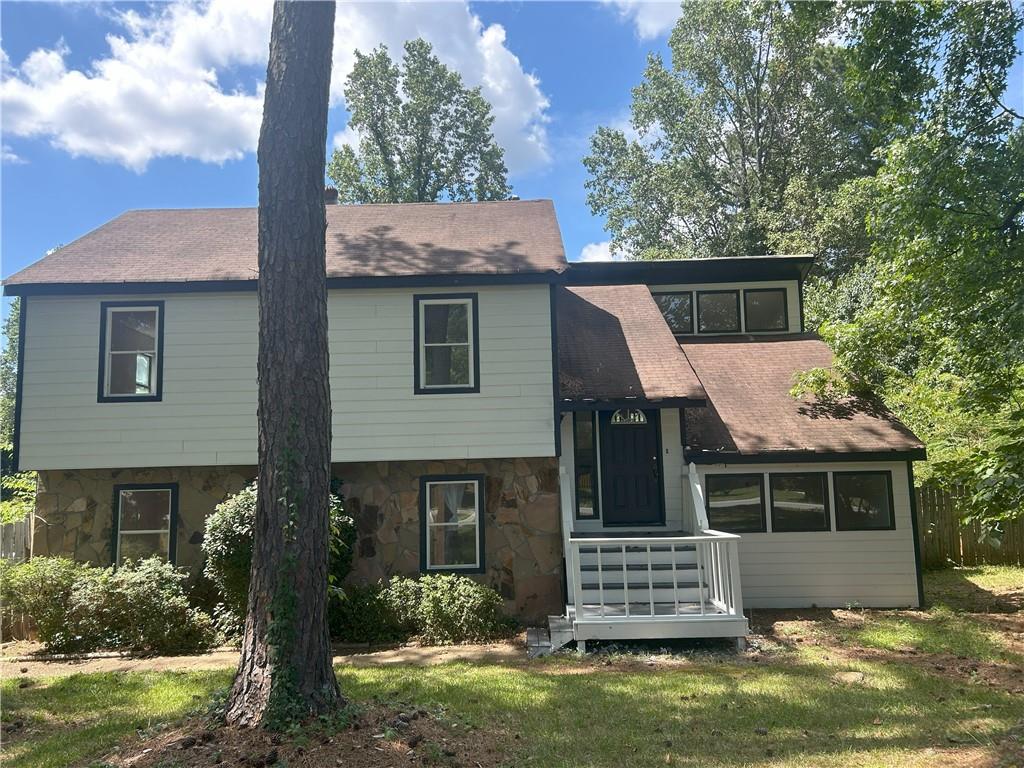 Ready to move in with freshly complete interior painted. No HOA so company vans & trucks, trailers, boats, RVs can be parked. Large level private backyard to enjoy outdoor activities, such as gardening, relaxing, gatherings, etc. Plenty of parking space in covered parking and open driveway. Easy access to Pleasant Hill, Buford Highway, Duluth Highway (SR 120) and I-85. Close to Wal-Mart, H Mart, ALDI, and Shorty Howell Park.