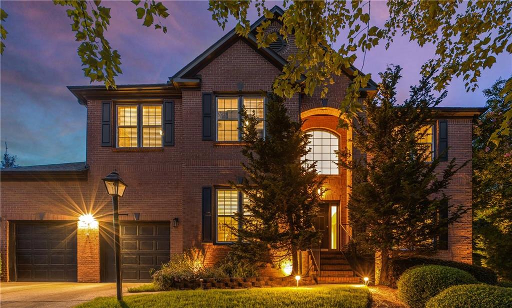 Welcome to one of the finest upgraded homes on the market in Smyrna—offered at an amazing value. This 4-bedroom, 3.5-bath home spans over 4,000 sq ft across three finished levels and features a multitude of upgrades. From the moment you arrive, the stately 3-sided brick exterior and elevated lot make a strong first impression. Inside, you’re welcomed by archways, wide-plank hardwood floors, fresh paint and trim, and elegant upgrades like the decorative dining room ceiling, custom iron railings, and a grand crystal chandelier.
The light-filled two-story foyer, flanked by a private office and gracious dining room, opens to a light and bright great room with soaring ceilings and an updated fireplace. The heart of the home is the designer kitchen, boasting a dramatic leathered granite waterfall island, Viking stainless steel appliances, CB2 hardware, concealed pull-out bins, a beverage fridge, and a sunny breakfast area. Just beyond the French doors is a serene screened-in porch —perfect for morning coffee or relaxing evenings—overlooking a large deck and fenced yard lined with mature cypress trees and LED landscape lighting—ideal for outdoor living.
Upstairs, the primary suite is a private retreat, complete with his-and-hers walk-in closets and a spa-like bath featuring a soaking tub, large frameless glass shower, and a sleek new floating vanity. Three additional bedrooms, a renovated hall bath with matching finishes, and a conveniently located laundry room complete the upper level.
The fully finished terrace level is designed for entertaining and easy everyday living. Enjoy a second living area that opens to the backyard, a full bath, a wet bar with beverage fridge, and a state-of-the-art home theater featuring recliners, projector, 7 in-wall speakers, and a remote-concealed screen. This level also includes a home gym, a dedicated wine room, and a large storage area, making it an incredibly flexible space that adapts to your lifestyle.
Meticulously maintained and designer-selected finishes, this home is move-in ready. Located in the sought-after Nickajack Elementary district with easy access to Downtown Atlanta, the airport, and everything Smyrna and Vinings offer—this is a home where lasting memories are ready to be made
