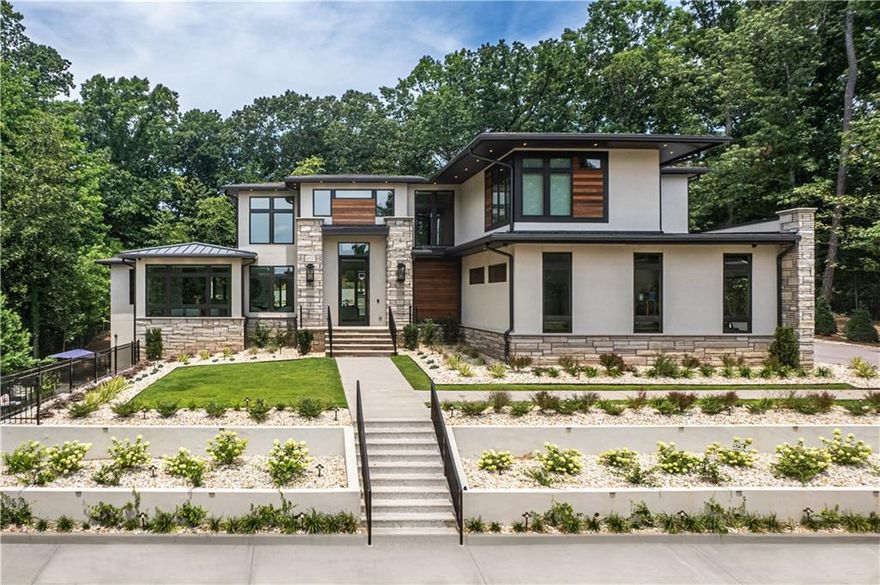 **See full video tour of this spectacular home** Quality-Built with every attention to detail, this modern design gated estate was created, designed and built by Stephanie Bell, Owner of Bella Fine Homes. Perched on a hilltop set 200 feet off the street, this 6 Bedroom 8 Bath home has state of the art, sleek designs with dramatic 21 foot ceilings upon entry. The fascinating curb appeal includes the perfect combination of Indiana Limestone, Brazilian Hardwood (IPE), hard coat stucco and 11’ tall glass entry door framed with Gas Lanterns. Soffits are lined with LED accent lighting for a spectacular evening showcase.

This Miami style custom estate boasts its own private backyard resort with a 53’ saltwater heated pool surrounding a fire pit with seating for 15, swim up bar stools and 16 person hot tub with 3 cascading waterfalls. Fire features include 2 fire bowls, linear fire table under lanai and linear fire pit in the center of the pool.  This entertainment haven is surrounded by a beautifully designed cabana, over 200 landscape lights, outdoor lanai heaters, outdoor sound system, outdoor kitchen/grill, outdoor bathroom/shower, Astroturf, palm trees, half court basketball, outdoor game tables and seating areas to accommodate 60 people.

Some of the features include:

*Bunk room with 8 custom built-in adult size bunk beds each with sconce lights, charging stations and in wall music.
*Astroturf backyard for the year round green manicured look
*In-ceiling sound system entire house
*Entire home automated Lutron lighting - set scenes and schedules
*Automated Shades
*9 Smart Toilets with bidets (master has 2 Smart toilets and traditional bidet)
*3” mitered quartz countertops in kitchen and baths/ floating vanities
*Elegant Glass stair railings
*2 In-wall IPADs for access to music, spa, lights and other smart features
*3 laundry rooms with in-wall ironing boards
*3 Kitchens with Italian Smeg appliances include 6 ovens, 2 built in espresso machines, 2 ice machines, 3 wine coolers, 3 microwaves, 2 warming drawers and 3 refrigerators
*Pella Clad Window and Doors with lifetime warranty
*Heated Floors entire main level
*Central vacuum on all levels
*Media room theater with 9.2 setup
*Vast network infrastructure and access points
*Full home audio including all of backyard/security and camera systems
*Fully controlled smart-home of the future, right at your fingertips!!

**Click on video link for full tour of home**