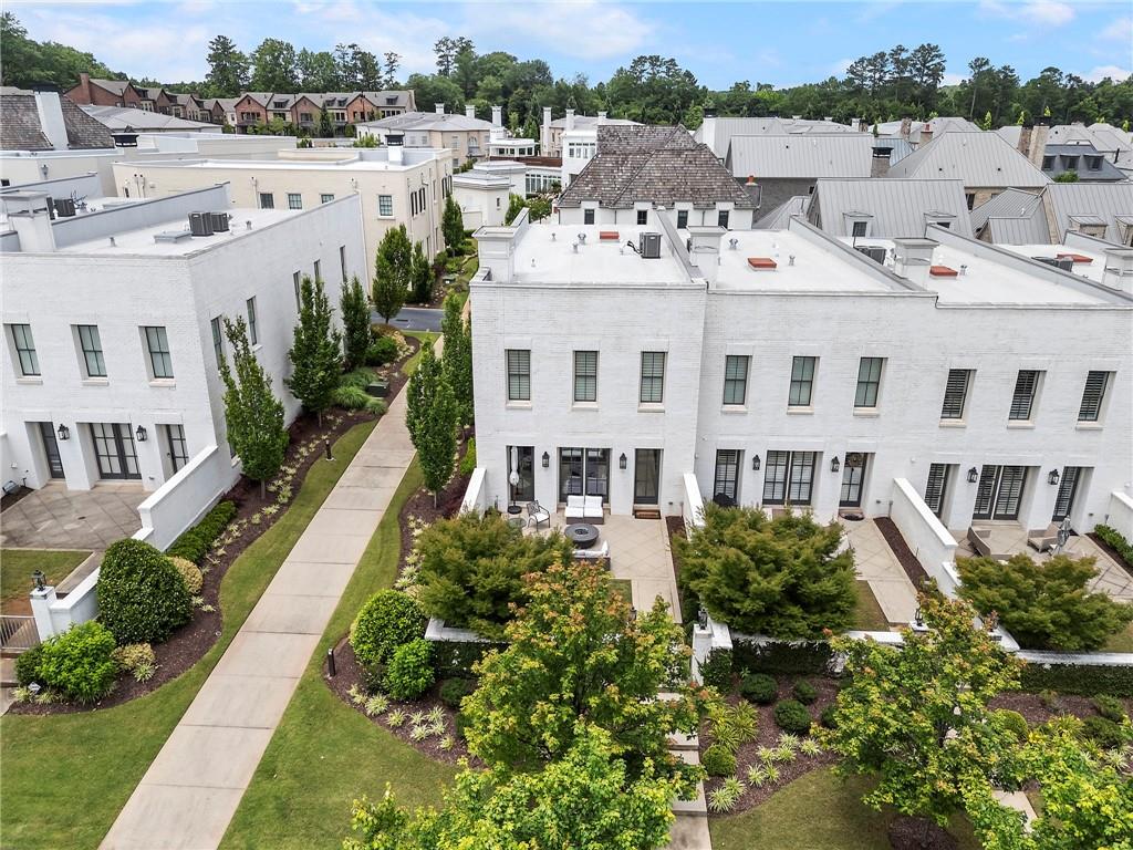 Luxury townhouse in the modern lifestyle community: AVALON! Hotel Avalon, Whole Foods, Award winning Restaurants, Movie, Upscale Shopping and Entertainment venues just moments away from your doorstep. Enjoying the events happening in the Avalon area. Just minutes from downtown Alpharetta and top-rated schools as well as prime access to the vibrant Alpha Loop. This beautiful two-story END UNIT townhouse features 3 bedrooms, 3.5 bathrooms. Great outdoor patio with a private gated garden area and 2 car rear entry garage! The open concept living area designed for both relaxation and entertainment, featuring 10-foot ceilings, hardwood floors and large windows seamlessly flows into the dining area and gourmet kitchen. The chef-inspired kitchen boasting Thermador stainless steel appliances, build-in Refrigerator, quartz countertops, sleek cabinetry and a generous island. Large walk-in pantry. The Oversize Primary Suite with sitting area features a boutique-inspired style walk-in closet and spa-like en-suite bathroom with dual vanity and a double-head shower. All bedrooms with private bathrooms. Enjoy the Community Amenities includes Swimming pool, Walking trails and Dog Park.