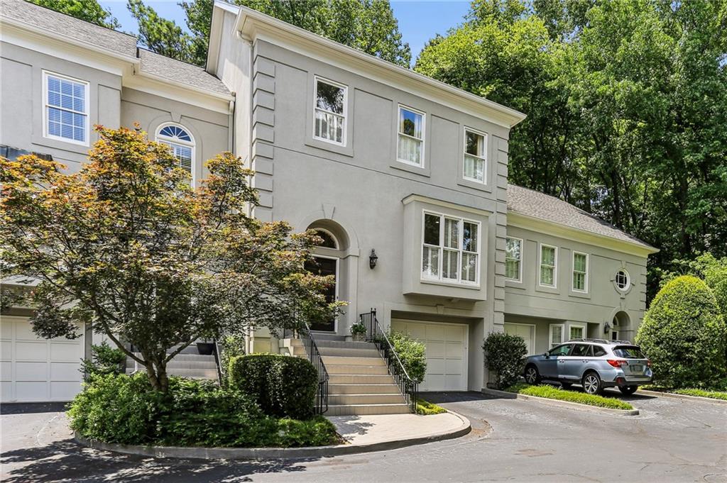 Charming and updated townhome in gated Historic Brookhaven neighborhood—just a short walk to Capital City Club, restaurants, and shopping. This low-maintenance home offers easy living in an unbeatable location.
Inside, the living room features a wall of windows and French doors opening to a balcony with wooded view, built-in bookcases, a mirrored bar and glass shelving, two Sub-Zero refrigerator drawers and a Scotsman nugget ice maker. Behind custom doors, you’ll also find a chic built-in desk nook with file drawers—perfect for a compact home office setup.
The kitchen is sun filled and thoughtfully updated for both style and function, with an elegant dining room just off the space-ideal for entertaining. A powder room is conveniently located on the main level.
And WOW-the completely renovated primary bath and custom closets! Both are very high-end, beautifully designed, and truly must-sees.
The second bedroom features its own full bath, while the spacious third bedroom is located on the terrace level and is currently used as a Rec/TV room with sleeper sofa-great Flex space.
Attention gardeners and dog owners: enjoy the rare benefit of a private fenced courtyard with a garden, patio, and direct access from the terrace level.
Additional highlights include permanent stairs to a floored attic with AMPLE storage and you could finish this space, if needed.
More features: Custom closets, shiplap accents, sliding barn doors, designer hardware, updated lighting, high ceilings and hardwood floors throughout.
This private and quiet community offers guest parking, with additional space nearby on Brookhaven Drive when entertaining.
A special home that blends charm, comfort, convenience, and space—all in one of the most desirable neighborhoods in Atlanta.
An extra bonus: Dekalb County/City of Brookhaven (lower taxes).