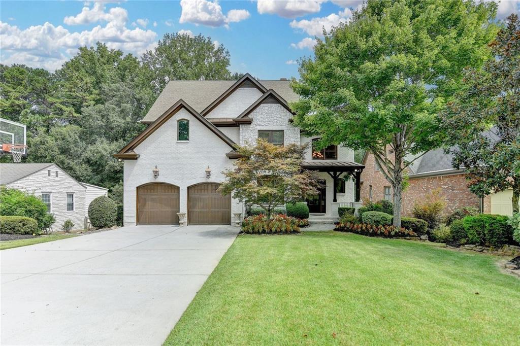 If you have been waiting for that special home, in a prime location in Ashford Park, welcome home!
This amazing home is ready for you to just unpack your bags.
As you enter the 2-story foyer, you will immediately notice the attention to detail.
Open dining room perfect for large gatherings, a bedroom on the main perfect for relatives, and a large fireside keeping room overlooking the kitchen. Updated kitchen with center island and expansive counters, with ample seating and top-of-the-line appliances, make you want to cook.
Separate kitchen dining and large enclosed deck overlook one of the area's best backyards.
If you want a large, fenced backyard, perfect for pets and families, you need to see this lot.
Upstairs there are 4 additional bedrooms and 3 full baths. The master suite has a fireplace and a wall of windows, with a large master bath with his and her vanities and large walk-in closet. Large secondary bathrooms as well.
The unfinished basement is ready for your vision. Hardwoods throughout and two brand-new HVAC systems with AprilAire Filtration and blown-in insulation ensure low utilities. This home also features upgraded insulation and a convenient EV charger.
This exceptional home is the best in luxury living in the middle of sought-after Ashford Park, where you can walk, bike, or take your golf cart to your favorite area restaurants. This home is truly a one-of-a-kind property.