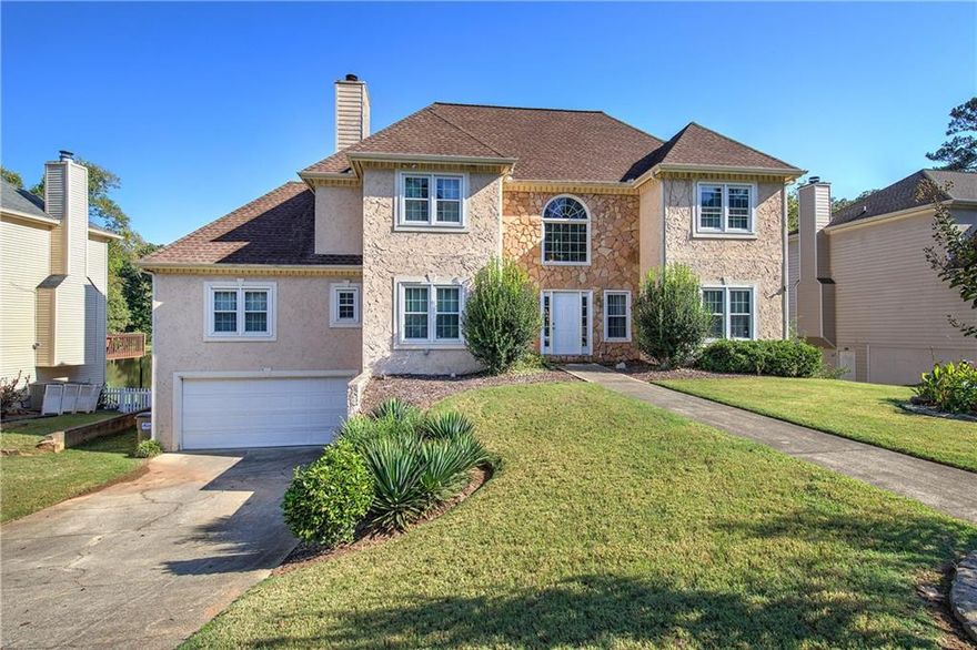 **Stunning Lakefront Property with Spacious Deck and Exceptional Features**  

Welcome to this beautiful lakefront home featuring a large back deck that overlooks the serene community lake—a perfect spot for relaxing or entertaining. The spacious foyer leads to a grand two-story living room with lots of windows that fill the room with natural light, complemented by a built-in bookcase for added charm.  
You'll love the kitchen with white cabinetry,  tiled backsplash, stainless steel appliances including new fridge in 2022, abundant counter space, and a cozy breakfast nook for casual dining. The main-level master suite is a true retreat, offering a vaulted ceiling, a large walk-in closet, and a cozy gas fireplace. The ensuite bath features two vanities, a soaking tub, and a large separate shower. Upstairs, you’ll find two well-sized bedrooms with a shared bath, plus an additional bedroom with its own private ensuite.
The walkout basement is complete with a large terrace that opens to the lake—perfect for fishing, setting up a firepit, and creating a seating area to enjoy the peaceful views. The basement also includes a finished bedroom and bath, as well as a versatile flex space ready for you to customize to fit your needs. HVAC replaced in 2022. Water heater recently replaced January 2025. Seller is Motivated therefore bring your offers and we will respond back to you within 24 hours. 

Don’t miss your chance to make this beautiful lakefront home your own!