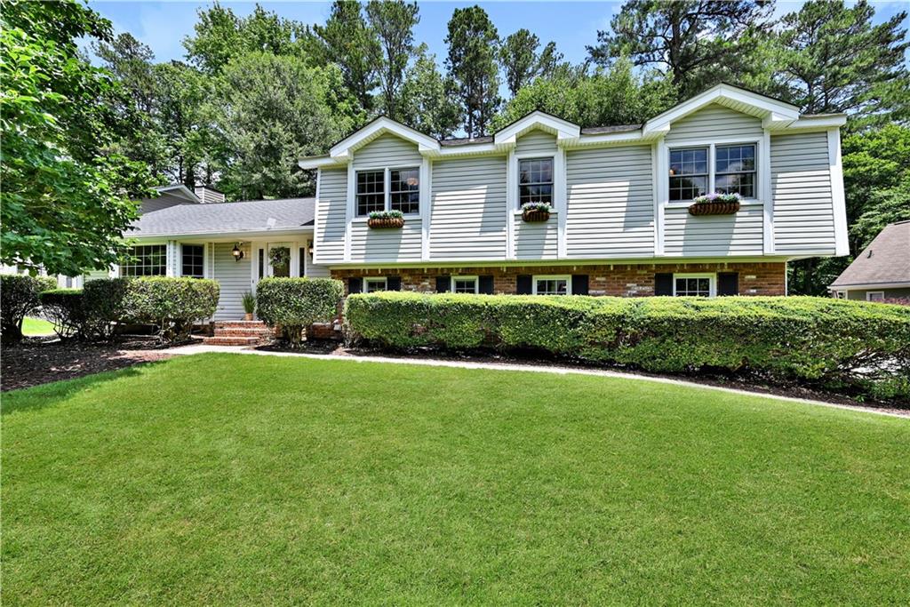 Welcome to this beautifully maintained 4-bedroom, 2.5-bath home in a highly sought-after East Cobb neighborhood. This move-in ready home features a newer roof, brand-new HVAC system, new upstairs carpet, and fresh paint throughout. The bright, open floor plan offers a seamless flow, perfect for everyday living and entertaining. Abundant storage options include a walk-around attic and a dedicated storage room off the garage, making organization a breeze. Step outside to your private backyard oasis—ideal for relaxing or future expansion—and enjoy the added convenience of a full irrigation system. Located in a top-rated school district and just minutes from shopping, dining, parks, major commuting routes and 20 minutes to Truist Park and The Battery. Don't miss this exceptional opportunity to own in a prime location with outstanding schools!