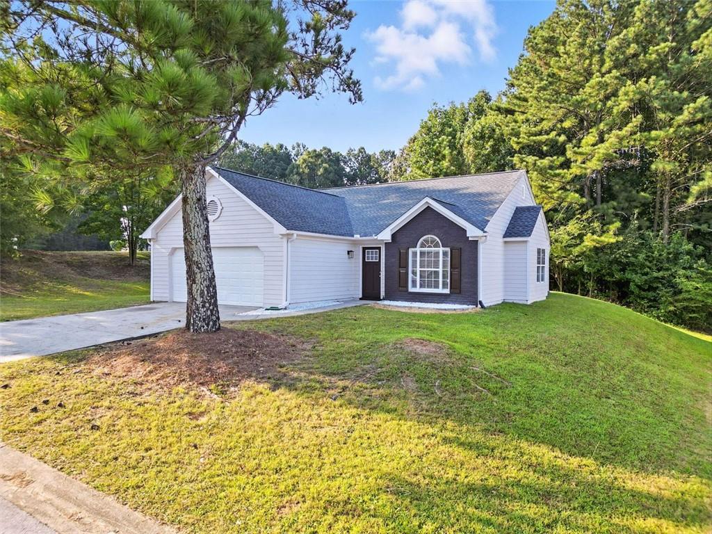 Welcome home to this adorable 3 bed 2 bath ranch. When you walk into the foyer, you are greeted with the laundry room and access to the two cars garage on your left and the formal dining on your right. The open concept kitchen boasts white cabinets and granite counter tops with a breakfast bar that leads into the fireside family room. Primary bedroom and ensuite features a vaulted ceiling and spacious bath. Sit and enjoy your morning or evening beverage on your patio overlooking your backyard. New Roof and new furnace! Home provides easy access to I20, Six Flags, shopping, restaurants, and schools. Come check out this home today!