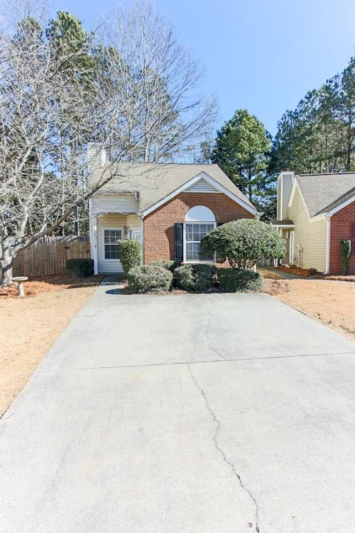Amazing location in Downtown Kennesaw close to Kennesaw State University. Walk to events, concerts, restaurants, community center and so much more. This is a single family home with no adjoining walls and a private, fenced-in backyard located in a quiet cul-de-sac in Village At Pine Mountain. Open Concept living with dramatic great room ceilings and recently renovated kitchen including granite counters, new cabinets, stainless appliances, separate laundry room. Recent master shower renovation to fully tiled low profile entry and glass doors. Trash/recycling and front yard mowing/mulch included in the monthly rent. Come drive-by, you'll love this adorable community! Owner pays HOA fees, no amenities. Owner may consider a single, house-trained, small pet. Income needs to be 3 X's monthly rent, good credit, employment and rental history required. $50 RENTSPREE application is required for each adult occupant.