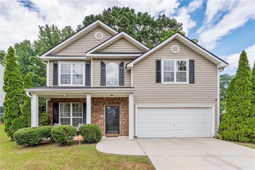 Just listed and recently updated, this move-in-ready home features 3 spacious bedrooms and 2.5 bathrooms with LVP flooring on the main level, fresh interior paint, and updated countertops. The kitchen is equipped with stainless steel appliances and overlooks both the breakfast area and the living room, making it perfect for entertaining. The oversized master suite boasts vaulted ceilings, two separate closets, and a large master bathroom with dual vanities. Additional updates include a recently replaced roof, offering added peace of mind. Conveniently located just a stone’s throw from I-20 with quick access to I-285, this home offers both comfort and unbeatable convenience for commuters and city-goers alike. This home would be the perfect first-time home and checks all the boxes.