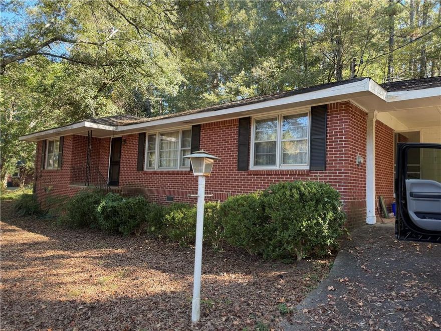 Brick ranch on a 3/4 acre lot located close to Lawrenceville Hwy, and Ronald Reagan Pkwy. One family owned since new. Needs TLC but has a newer roof, newer furnace, all brick on a beautiful lot.
