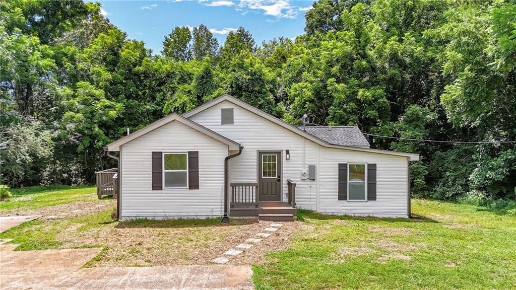 Come see this beautifully renovated ranch-style home offering modern updates and timeless charm. This 3-bedroom, 2-bath gem features brand-new Luxury Vinyl Plank flooring throughout, a new roof, fresh interior and exterior paint, new HVAC system, updated lighting and plumbing fixtures, and new quartz countertops in both the kitchen and bathrooms. The bright and inviting living room features large windows with views into the updated kitchen, which boasts quartz counters, stainless steel appliances, and a separate dining area. The spacious primary suite includes a fully renovated en-suite bath with all-new tile, double vanity with quartz counters, and a low-flow toilet. Two additional bedrooms share a beautifully updated hall bath with granite countertops, a low-flow toilet, and a tub/shower combo. Enjoy the charming front porch and entertain on the brand-new back deck—perfect for grilling and relaxing.