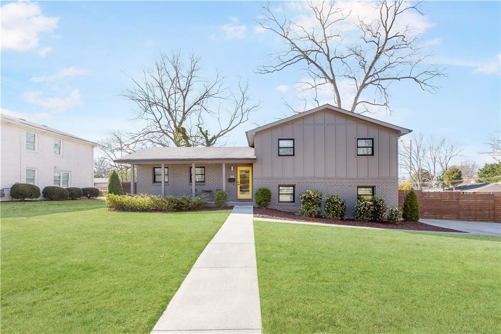 This beautifully remodeled home offers a perfect blend of contemporary style and modern finishes, situated near the vibrant Marietta Square. Every aspect of this residence has been thoughtfully updated, including new lighting, windows, HVAC, plumbing, electrical systems, and exterior siding, ensuring both style and efficiency.Upon entering, you'll be greeted by light hardwood floors and a vaulted ceiling that enhance the open concept living space, creating an inviting and airy atmosphere. The kitchen is a chef's dream, featuring sleek white lacquered cabinets, elegant quartz countertops, designer tile, and top-of-the-line stainless steel appliances, making it both stylish and functional. Outdoor living is equally impressive with a screened-in porch perfect for enjoying tranquil mornings, and an adjoining grilling porch that's ideal for entertaining. The second level boasts a luxurious primary suite, complete with dual closets and a walk-in shower for a spa-like retreat. Two additional bedrooms and a full bath offer ample space for family or guests. The terrace level is designed for versatility, including a mudroom, laundry room, a fourth bedroom, a full bath, and a recreational room or office, catering to a variety of lifestyle needs. Nestled on a level corner lot, the property features fenced back and side yards for privacy and play, along with a spacious front yard. This home is a true gem, offering both modern amenities and a prime location.