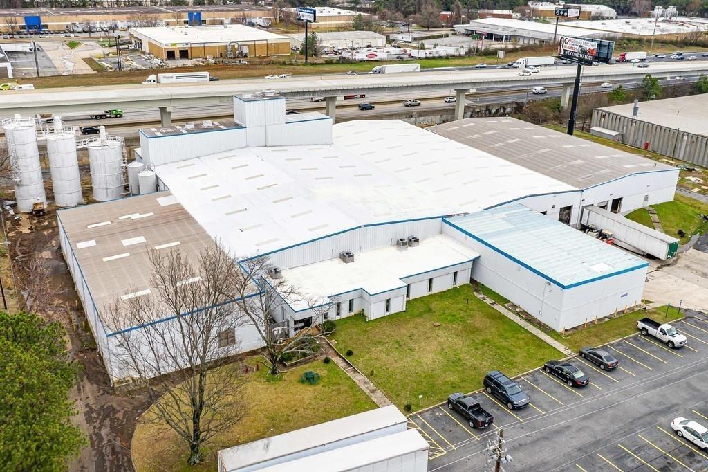 Location, Location, Location! Massive Warehouse In I-75 Marietta Industrial Park! Totaling 65,000 + square footage on 4.19 acres! Max Power 480. Storage Center, Motorhome/RV, Auto/Boat, Pods. Approximately 3,000 Square Feet Of Office Space & 62,325 Square Feet Of Warehouse. Perfect For Large Distribution Or Manufacturing Companies - Lumber, Steel, Granite, etc! Major Road Frontage & Visibility! Easy Access To I-75! 60 parking places! 2 Dock High Rail Doors Served By CSX, 5 Dock Door With Levelers, 16-23' Clear Height, Fenced & Secure Truck Court, Outside Storage, Heavy Industrial Zoning, Heavy Power. In Sought-After Marietta Industrial Location! Lumber Yard & Rail Access. Strategic Logistics Hub. Lease Option For The Right Side Available $34,000/Month.