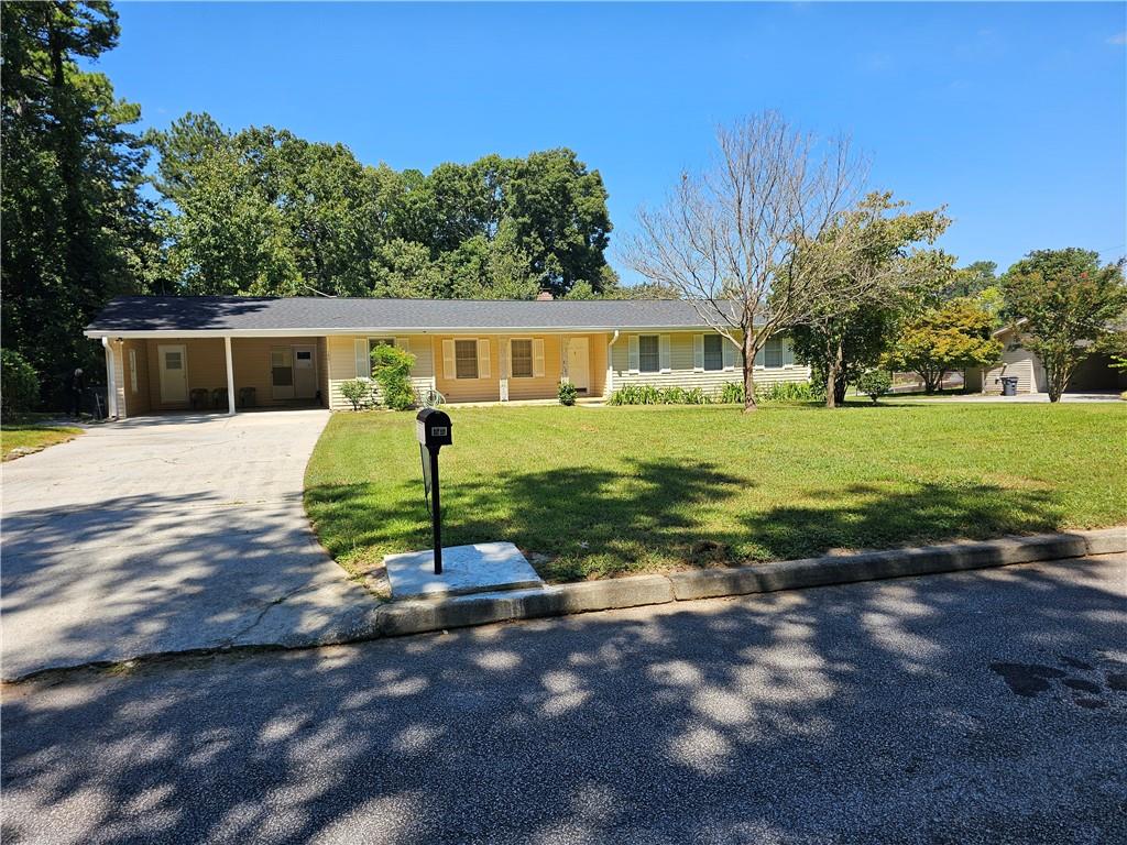 Renovated open concept ranch located in Snellville North subdivision. New roof about three years old, new paint, new LVP flooring through the whole house, and granite countertops make this home move in ready. Eat in kitchen with open living area and separate dining room. Spacious three bedrooms and two full baths with separate laundry room. New bath tubs, Large level lot with separate outbuilding. The septic tank just serviced and cleaned and inspected, Come see this charming home that is convenient to shopping and located in Grayson school district.