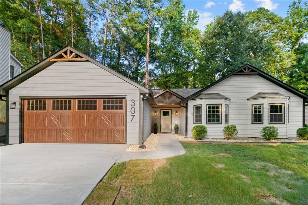 Fully Renovated 3BR/2BA Home in the Heart of Peachtree City – NO HOA! The home appraised $497,000 on August 2025. This home qualify for a 100% Financing, No PMI!!! Move-in ready and better than new! This beautifully updated 3-bedroom, 2-bathroom ranch is perfectly located in the heart of Peachtree City—just minutes from Lake Peachtree, Glenloch Recreation Center, golf cart paths, shopping, dining, and top-rated schools. Tucked in a quiet, established neighborhood with no HOA, this home is packed with high-end upgrades and thoughtful design. Washer and Dryer Included!!! Interior Features & Upgrades: Completely renovated kitchen with all new cabinets, quartz countertops, tile backsplash, and brand-new stainless steel appliances Luxury vinyl plank flooring throughout main living areas and primary bedroom New carpet in secondary bedrooms and new tile flooring in bathrooms Fully remodeled bathrooms featuring tiled showers, modern fixtures, and a frameless glass shower in the primary suite Custom closet in primary bedroom Fresh interior and exterior paint, including ceilings All new interior and exterior doors with updated hardware Stylish new light fixtures and plumbing fixtures throughout Cozy living room with new fireplace and chimney Major System Updates: New roof New HVAC system New water heater New garage door Cleaned air ducts and dryer vent Termite protection with new stations and transferrable 1-year service Exterior Highlights: New modern black gutters New concrete patio—perfect for entertaining Fully fenced backyard with beautiful views Professionally pressure washed exterior With its open layout, quality finishes, and unbeatable location in a golf cart-friendly community, this turnkey home checks every box. Schedule your private showing today and experience the best of Peachtree City living!