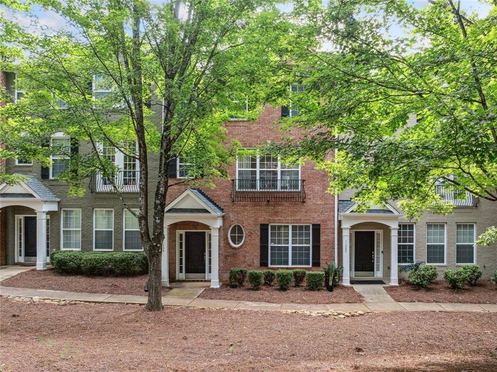 Welcome to this beautifully renovated townhome in a prime Alpharetta location just 1.6 miles from downtown and only 2 miles from The Avalon. Experience the best of North Fulton living! You’re just minutes away from Ameris Bank Amphitheatre, North Point Mall, great schools, dining, and parks. This home blends modern design with everyday comfort in a vibrant and sought-after community.
Step inside to see a main level with an open concept. The kitchen has a stunning quartz center island with a waterfall edge. It also features updated cabinetry and custom lighting. The spacious dining area flows into the living room, perfect for hosting and relaxing. The handy powder room and game closet add practicality. The balcony off the living room is perfect for morning coffee or evening barbecues.
The current homeowner has made many updates. They replaced the flooring with luxury options and removed all carpet. They added designer lighting fixtures and custom accent walls that bring texture and charm. The upstairs owner suite feels like a private getaway. It has a spa-like bathroom with a soaking tub, dual vanities, and a separate shower. Plus, there’s a custom closet system for great organization.
Two additional bedrooms upstairs provide generous space and storage. The terrace level features a fourth bedroom or flexible bonus space with its own full bath, ideal for guests, a home office, or media room.
This townhome is ready for you to move in. It features low-maintenance living and upscale finishes. Plus, it’s in one of the most sought-after areas of Alpharetta. Whether you are looking for a stylish place to entertain or a peaceful place to unwind, this home has it all.