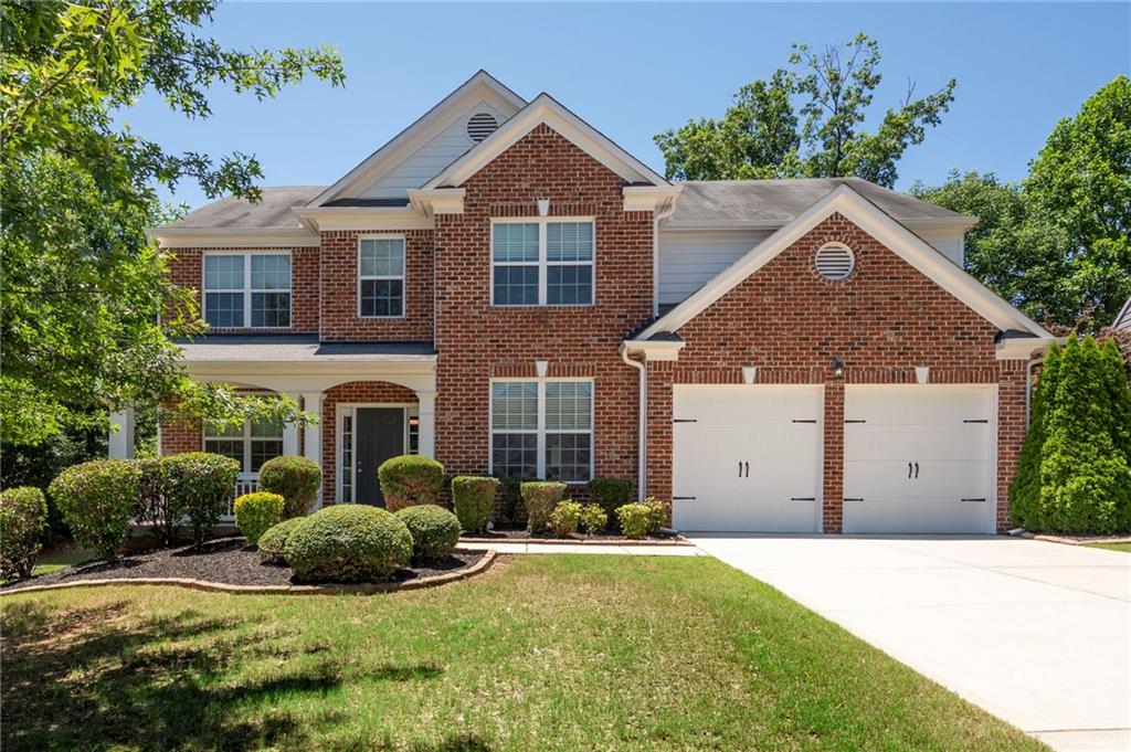 Spacious Five-Bedroom Traditional in Sought-After Madison Falls. Welcome to this beautifully updated home situated on one of the largest fully fenced lots in the Madison Falls community. Ideally located between Downtown Woodstock and Roswell, this home offers both convenience and charm. Inside, you’ll find freshly updated neutral tones and new LVP flooring upstairs — with no carpet throughout the entire home. The main level features a separate dining room and a dedicated office space, ideal for today’s flexible lifestyles. The two-story living room is bright and open, connecting seamlessly to a crisp white kitchen complete with stainless steel appliances and granite countertops — great for both daily living and entertaining. Guests will appreciate the main-level bedroom with a full bath, while the sunroom with its updated two-sided fireplace offers a cozy spot for morning coffee or quiet relaxation. Upstairs, there are four additional bedrooms including the owner’s suite, which features a spacious custom walk-in closet. Updated garage storage racks mounted from the ceiling makes accessing your seasonal items or toys easy. Enjoy all that Madison Falls has to offer, including a community pool, playground, and an active HOA. Located in a top-rated school district, this home is a wonderful opportunity in a well-maintained neighborhood.