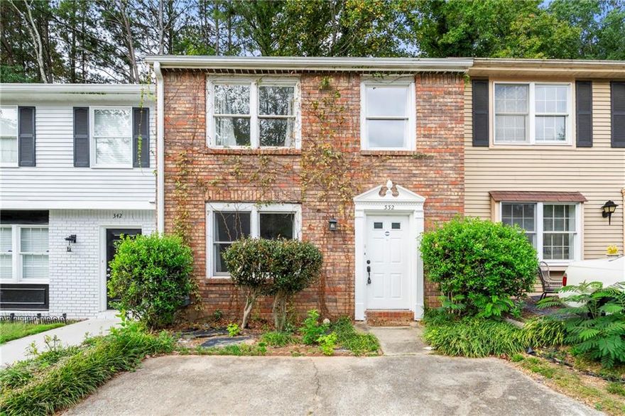 Great investment brick front townhome in a fabulous location! Laminate flooring on main level, fenced backyard with storage building, roommate floorplan, walk in closet, needs TLC. This home is only 3 miles from Marietta Square, just minutes to i-75, close to shopping and restaurants.