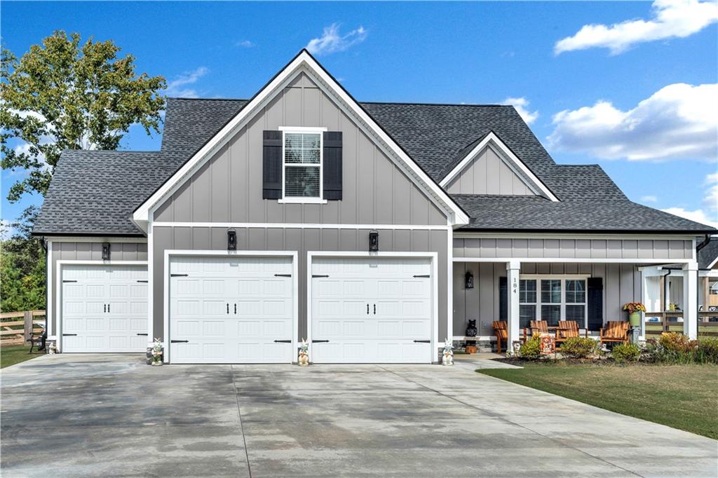 Nestled on a spacious, level lot in the heart of charming Ringgold, this beautifully designed two-year-old home welcomes you with warmth and modern elegance. Step inside to an airy open-concept main level where natural light dances across rich quartz countertops and gleaming stainless steel appliances in the kitchen, which flows seamlessly into a dining area and a cozy living room anchored by a striking specialty ceiling and a gas fireplace—perfect for gathering on cool evenings. The main-floor owner’s suite is a serene retreat, featuring a luxurious ensuite with dual vanities, two oversized walk-in closets, a soothing soaking tub, and a large separate tiled shower. Upstairs, two inviting bedrooms and a full bath offer comfort and privacy, and finished bonus room upstairs offering tons of extra storage or guest space. Outside, enjoy the gentle breeze from covered front and back porches, ideal for morning coffee or weekend get-togethers. With a two-car garage and additional utility garage with OnCue sensors for garage doors - allowing for remote phone operation - and WPC 12 mil Vinyl Plan flooring throughout, this home blends convenience with timeless style in a truly peaceful setting. Schedule your showing today and make this one yours!!