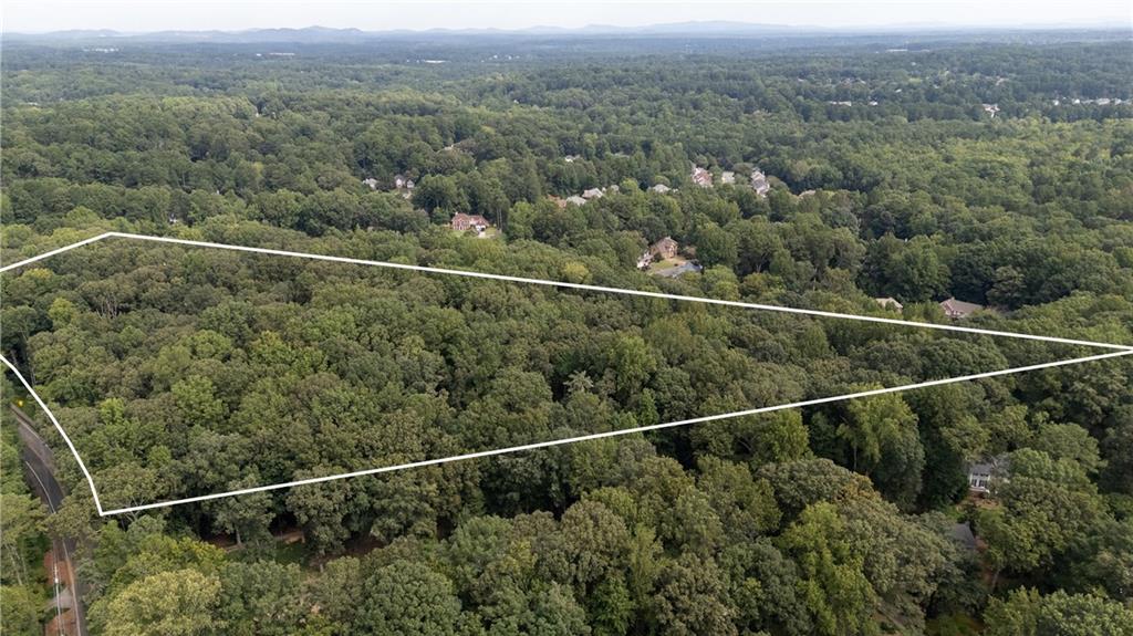 Build your dream home on this gorgeous wooded lot in Kennesaw! Nestled in a small, gated community of just six to-be custom homes, this property offers the perfect balance of privacy and convenience. The nearly acre-sized lot provides ample space for your design, with the option to add a pool and still enjoy plenty of yard. Surrounded by nature, the setting feels tucked away while still being just minutes from West Cobb shopping, dining, and top-rated schools. A rare opportunity to create the home you’ve always envisioned in one of Cobb County’s most desirable areas. Lots will be buildable by end of 2025