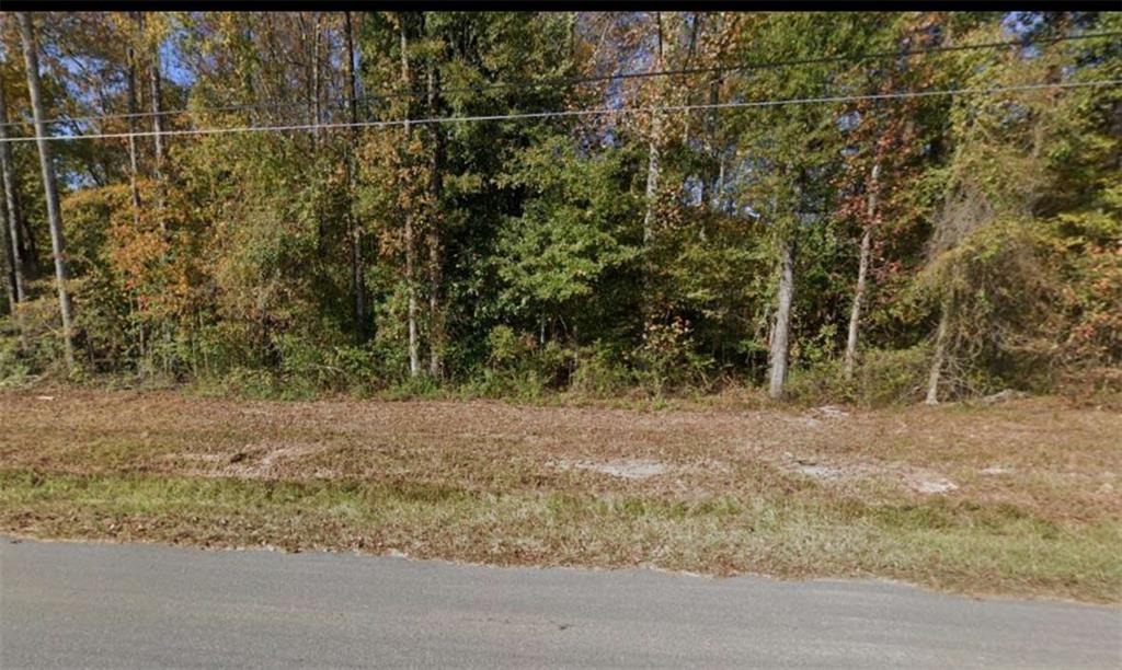Build Without Limits on City Pond Rd! Seize the freedom to design exactly what you want on this 1.9-acre, unrestricted parcel in Oxford's scenic Newton County. Outside the city limits-no HOA. Level, lightly wooded topography offers multiple homesites plus room for a workshop, garden, animals, or hobby farm. Paved road frontage with public water & power at the street; soils are suitable for a septic system. Live minutes from Covington's historic square, downtown Oxford, and I-20 for an easy ~45-minute commute to Atlanta. Weekend adventures await at nearby City Pond Park, the Oxford Trail, and sparkling Carters Lake. Rare chance to own versatile land in a fast-growing area-bring your plans and start crafting a lifestyle without rules! Sale price $59,990.