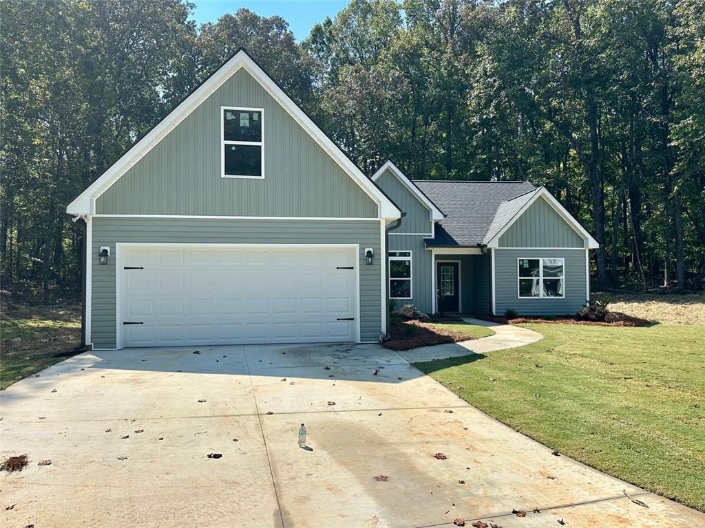 NO HOA! Conveniently located just off GA Hwy 60 on peaceful Bird Rd in desirable North Hall, this stunning Kristen floor plan offers the ease of step-less ranch living with all bedrooms and bathrooms on the main level, plus a finished bonus room upstairs for a fourth bedroom or flexible space. The open-concept design features granite countertops and durable LVP flooring throughout the living and kitchen areas, combining style with low-maintenance living. Enjoy quiet mornings or relaxing evenings on your private, covered back patio. With its prime location, you’re just 10 minutes from both Gainesville and Dahlonega, and only a short drive to Dawsonville. Affordable living in a brand-new home — don’t miss this opportunity!