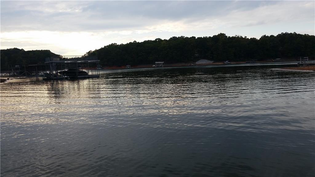 Beautiful lot for sale in the established Ridgewater On Lanier subdivision. A resort-style neighborhood with a clubhouse, swimming pool, tennis courts, community dock, and great views of Lake Lanier. Conveniently located near North Georgia Premium Outlets, shopping, and dining. A five-minute drive to the Toto Creek Park boat ramp. A fantastic opportunity to build your dream home!