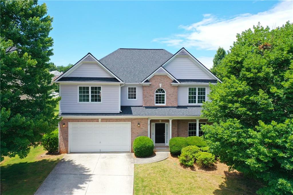 In the sought-after Shiloh Valley community, this 4-bed, 2.5-bath floor plan is beautifully maintained and freshly updated for immediate move-in! Enter 138 McCook Way NW to find a two-story entrance foyer that welcomes you into a bright, just-painted home with brand new carpet throughout the steps and upstairs. On the lower level, find tile and luxury vinyl plank flooring throughout. Renovated kitchen features upscale granite counters and island, stainless steel appliances, including gas range for the chef of the family. Living area with a stunning gas fireplace is accessible from the kitchen. Formal dining room, living room, half bath and several closets/pantry also on this level. Upstairs, a lavish primary suite with a tray ceiling features TWO walk-in closets, a spacious ensuite bathroom with double vanities, and a soaking tub. 3 more spacious bedrooms upstairs share the hall bath which also has a double vanity. Laundry room on this level with washer/dryer remaining. Outside, this home's beautifully fenced and landscaped backyard offers a tranquil space with new covered patio added in 2020. Neighbors love Shiloh Valley for its charming streets, beautiful pool and clubhouse, tennis court and more. Check out the 3D Tour! NO RENTAL RESTRICTIONS!