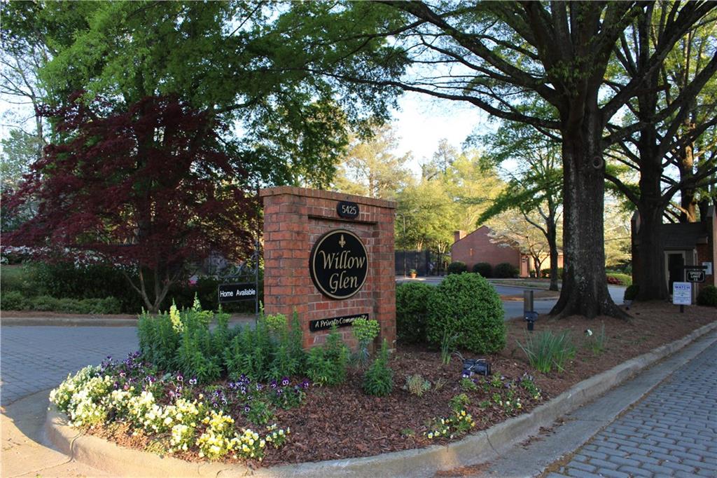 Renovated gem inside 285 off Glenridge. Includes a 2 car garage with private front courtyard and private back patio. 2 sets of French doors open to patio from dining room and living room. Gas fireplace in living room. New appliances in the kitchen as well as renovations. New hardwoods upstairs and expansion to the master bedroom. Newly configured master bath with Marble floors, over-sized shower and double vanity. Wood shutters on windows. Great for entertaining. Awesome sq. footage. Pool, tennis, clubhouse. Pet-friendly. Move in ready. Seller to pay 1 year HOA.