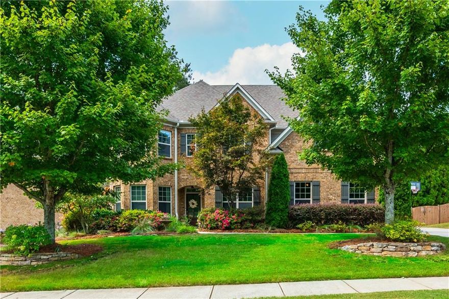 Imagine a meticulously maintained brick Estate Home, with soaring ceilings and Open Floor Plan, so convenient to everything you can’t imagine being located on a quiet street with a sprawling yard that suits all lifestyles. Welcome to 2571 Walden Estates, located in one of our favorite Luxury Communities in East Cobb.  A symphony of space and style, this 5 Bed, 4 Bath home unfolds across nearly 3,800 Square Feet promising a uniquely curated space for everyone in your family, including your fur baby! Enter through the stained solid wood door into the foyer with a barrel-vault ceiling. Your office with coffered ceilings & french doors is located to the left and the perfect quiet setup with tons of light so you don’t have to go to that lifeless office at corporate headquarters.  Formal Dining Room features trey ceiling, board & batten feature wall & is large enough for 12 person gatherings.  Straight ahead, the Family Room awaits you; however, wait a minute. Don’t forget to look to your right & notice the custom built & curated residence located 2571-1/2, awaiting your furry friends (or your spouse’s new residence when he inevitably ends up in the literal dog house). Family Room flows seamlessly into the Kitchen, forming the heart of the home, & features coffered ceilings & stone fireplace flanked by built-ins.  Kitchen features stained cabinets, granite counters, large single bowl sink, full suite of stainless appliances including gas cooktop & large island with seating. Did someone call Southern Living because your dream pantry includes custom built-ins, butcher block counter, undermount lighting & room for wine/beverage fridge. Rounding the corner is a Mudroom with built-ins, to store all the things, and your 3 garages. Single Garage is equipped with EV Charger. Main Floor also features a Bed & Full Bath that would be ideal for Multi-Gen Living / Lounge / Playroom.  Upstairs, the expansive Primary Suite is perfect for the King & Queen of the home & boasts a tray ceiling, sitting area & spa-like bath complete with double vanity, soaking tub & shower.  TV above the tub, so you don’t miss your favorite game or episode of Bridgerton while relaxing (hiding) from rest of the family!  At the end of the Upstairs Hall, you will find 2 additional Beds (Jack-N-Jill) that share a Bath.  Additional Secondary Bed & Bath perfect for larger families or additional Guest Room. Sorry boys, the final Secondary Bed & Ensuite Bath was specially curated for the Princess.  Upstairs features large Media Room / Flex Room w/custom built-ins.  Laundry Room is located just off the Primary Suite.  Freshly painted Exterior with Pro House & Landscape Lighting.  Outside, enjoy a sprawling private fenced backyard ideal for kiddos or fur babies to burn off some energy. Covered Patio with Ceiling Fan & TV perfect for relaxing evenings, outdoor dining / entertaining.  For the gardeners, metal framed beds to grow herbs, flowers & fresh vegetables (for some of us, place to prove we can’t grow anything). Stone patio adjacent to garden under magnolia tree for al fresco dining under the stars.  Irrigation, Security Cameras & Exterior Doors controlled by Smart Phone.  You are about to own a gorgeous home in the trifecta of School Districts.  If you head East on Post Oak Tritt & walk, ride or roll to Tritt ES (or as us locals like to call it… the “Disney” of elementary schools). You can head West & in minutes pull up to Hightower MS. Travel a little further West & arrive at Pope HS where Academics & Athletics soar higher than the US National Debt & are ranked as some of the best in all of Georgia.  Estates of Walden is a single cul-de-sac street of Luxury Homes, adjacent to Walden Subdivision, a vibrant Swim & Tennis Community all included in your Annual HOA Dues. Need groceries?  You have 5 options within 2 miles! Shopping, Restaurants, Gas & Historic Roswell all minutes away.  The convenient Location, amazing schools & gorgeous upgrades are hard to beat!